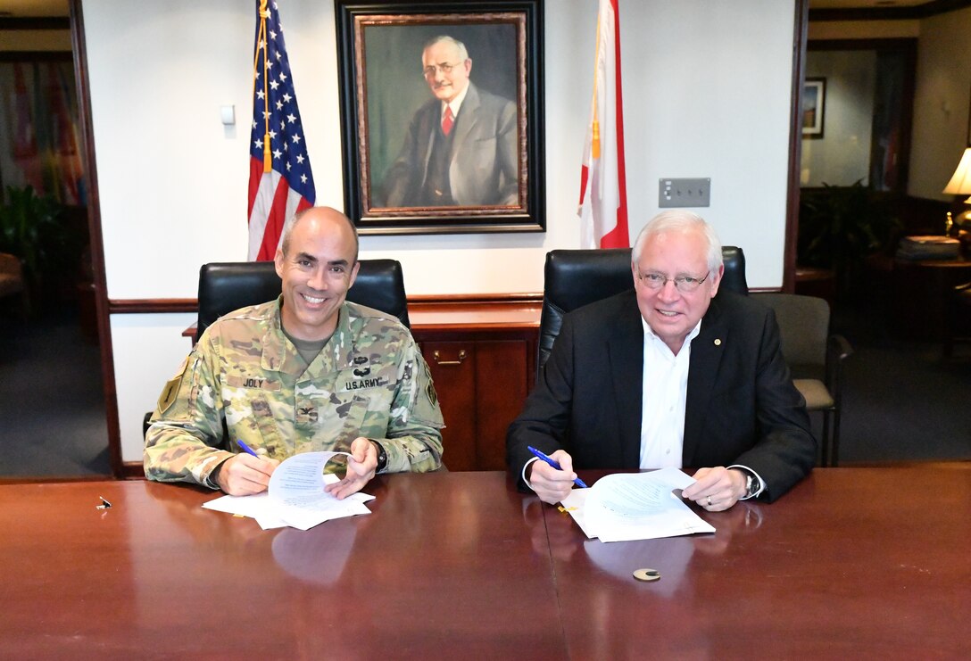 Col. Sebastien P. Joly, commander of USACE Mobile District, and James Lyons, director and CEO of the Alabama State Port Authority, sign the design agreement for the Mobile Harbor, Alabama Project on Oct. 2, 2019, at the Port of Mobile.