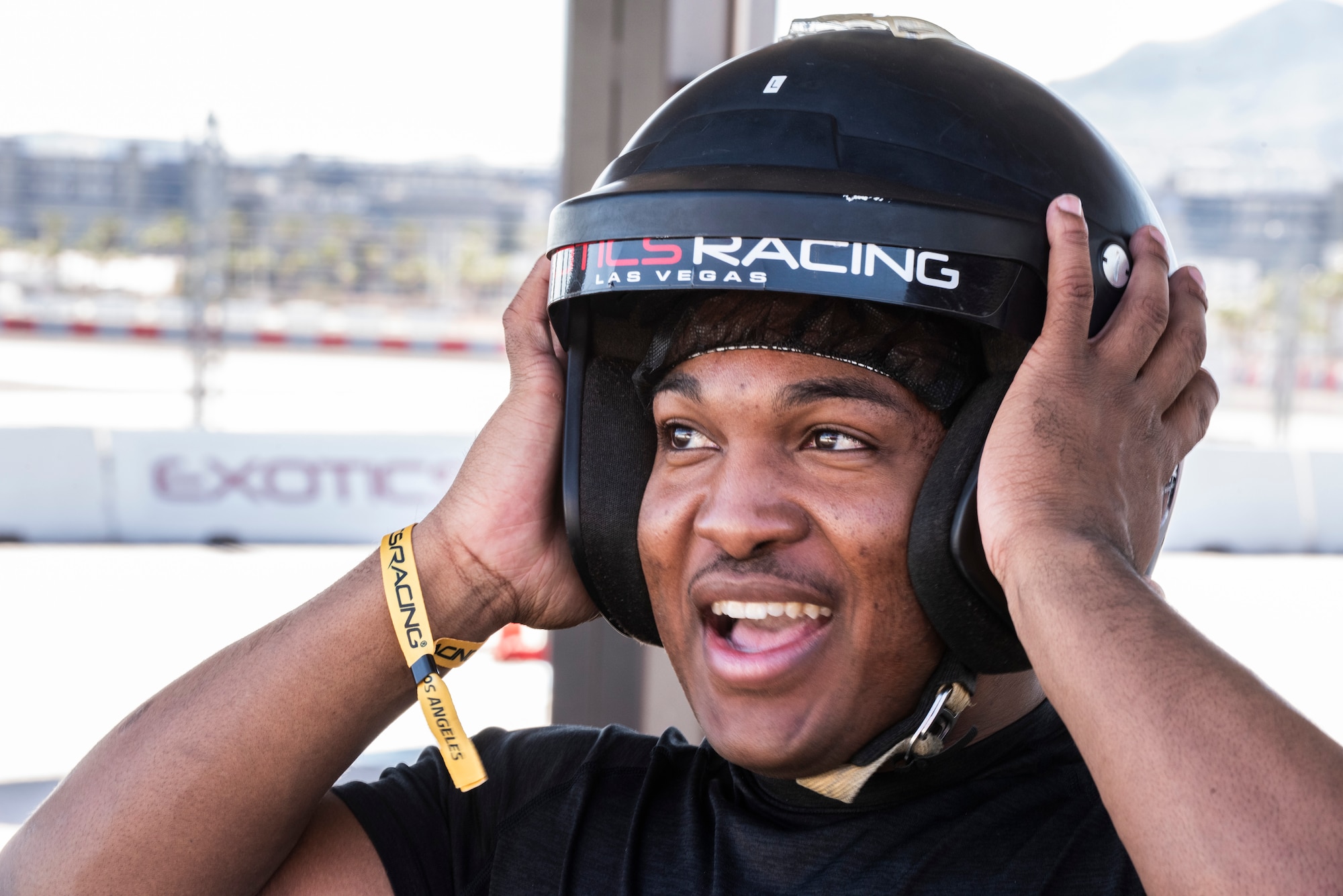 An Airman tries on a helmet at a race track in Las Vegas