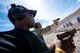 U.S. Air Force Tech. Sgt. Rashodrick Jackson, a transmissions systems section chief assigned to the 99th Communications Squadron (CS), fires a handgun at an undisclosed location in Las Vegas, April 3, 2019. Annual award winners assigned to the 99th CS were given the opportunity to choose from two leadership and character development experiences as part of the new Adventurous Training Program. (U.S. Air Force photo by Staff Sgt. Joshua Kleinholz)