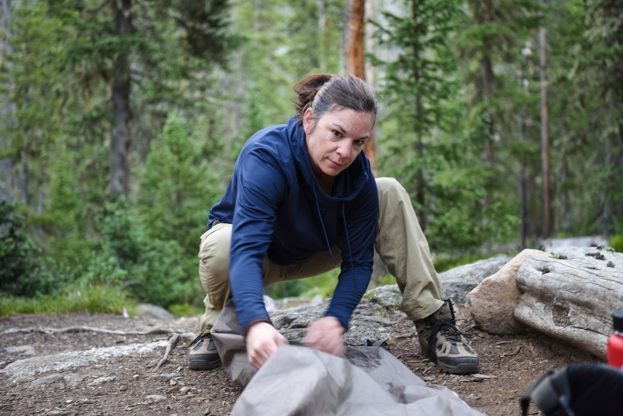 An Airmen packs up a tent in Colorado