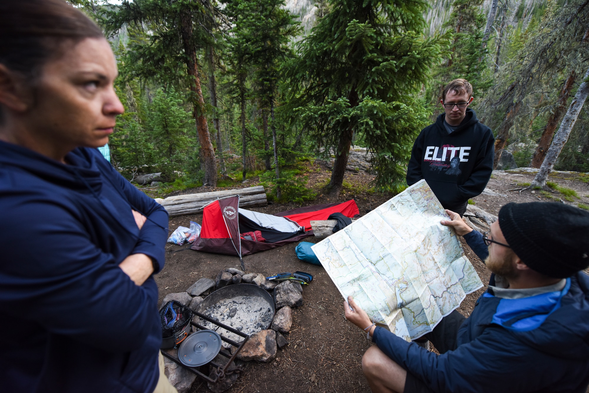 Airmen look at a map during a camping trip in Colorado