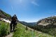 Annual award winners assigned to the 99th Communications Squadron cross a steep, snow-packed section during a backpacking trip across the Continental Divide in Rocky Mountain National Park, Colorado, July 20, 2019. Cautious and deliberate movements were necessary in snow-packed areas due to the risk of steep falls. (U.S. Air Force photo by Staff Sgt. Joshua Kleinholz)