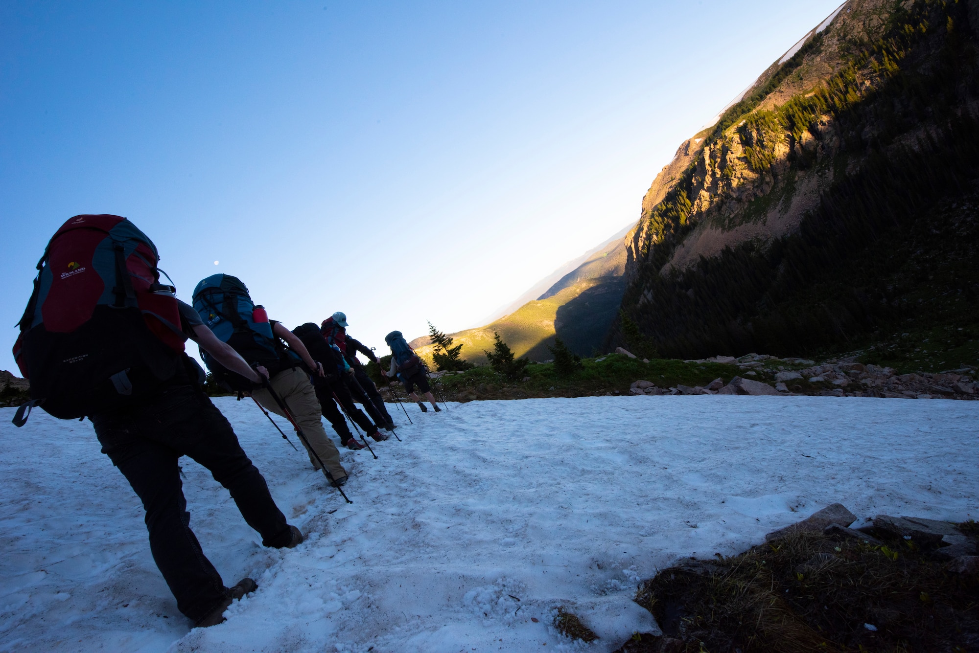 Airmen walk across snow in Colorado