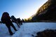 Annual award winners assigned to the 99th Communications Squadron cross a steep, snow-packed section during a backpacking trip across the Continental Divide in Rocky Mountain National Park, Colorado, July 20, 2019. Cautious and deliberate movements were necessary in snow-packed areas due to the risk of steep falls. (U.S. Air Force photo by Staff Sgt. Joshua Kleinholz)