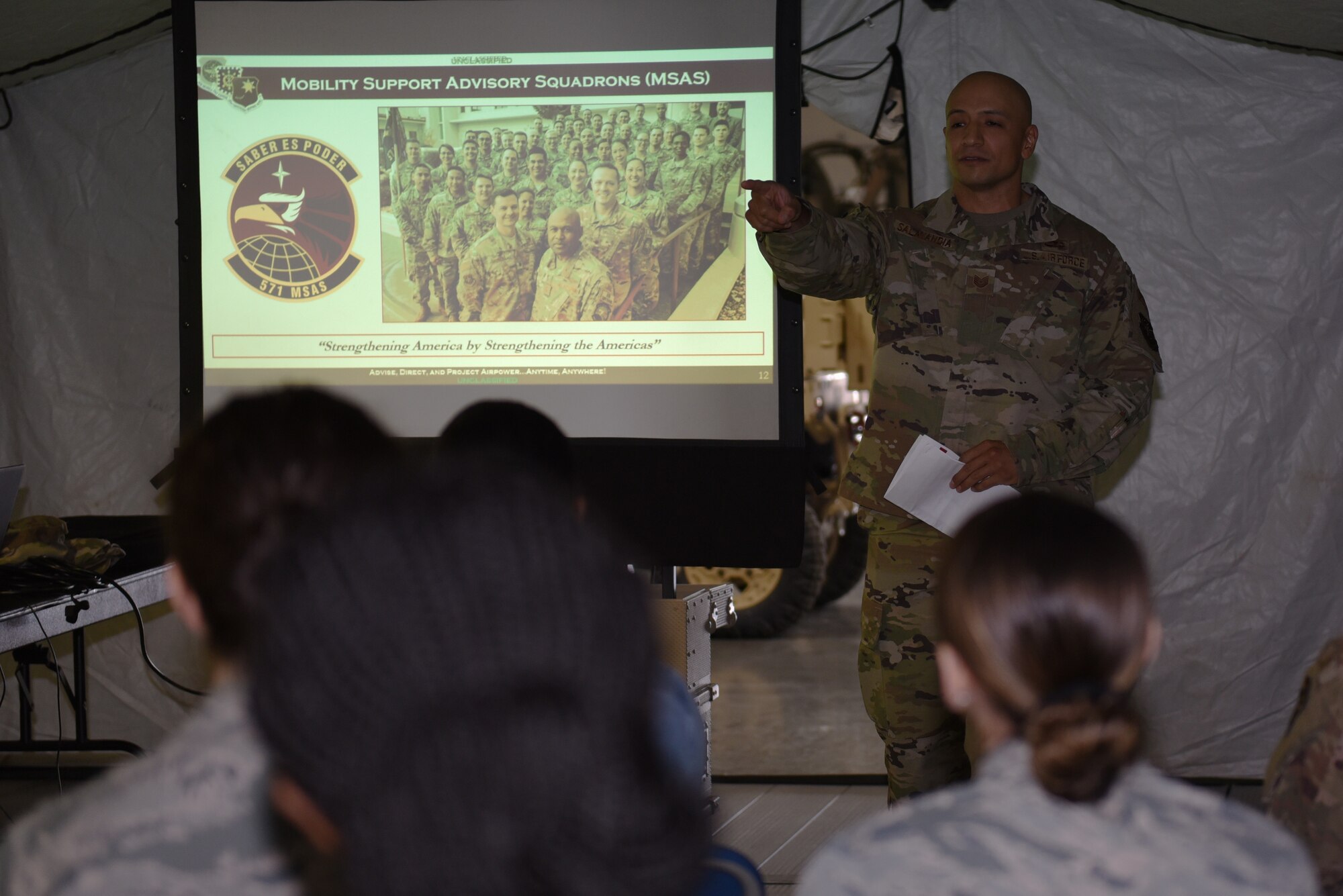 U.S. Air Force Tech. Sgt. Sergio Salayandia, 571st Mobility Support Advisory Squadron air advisor, briefs Airmen about the responsibilities of the 571st MSAS during the Airmen Enrichment Program Sept. 27, 2019, at Travis Air Force Base, California. The program offers Airmen the opportunity to learn about the numerous specialties the Air Force has to offer. (U.S. Air Force photo by Airman 1st Class Cameron Otte)