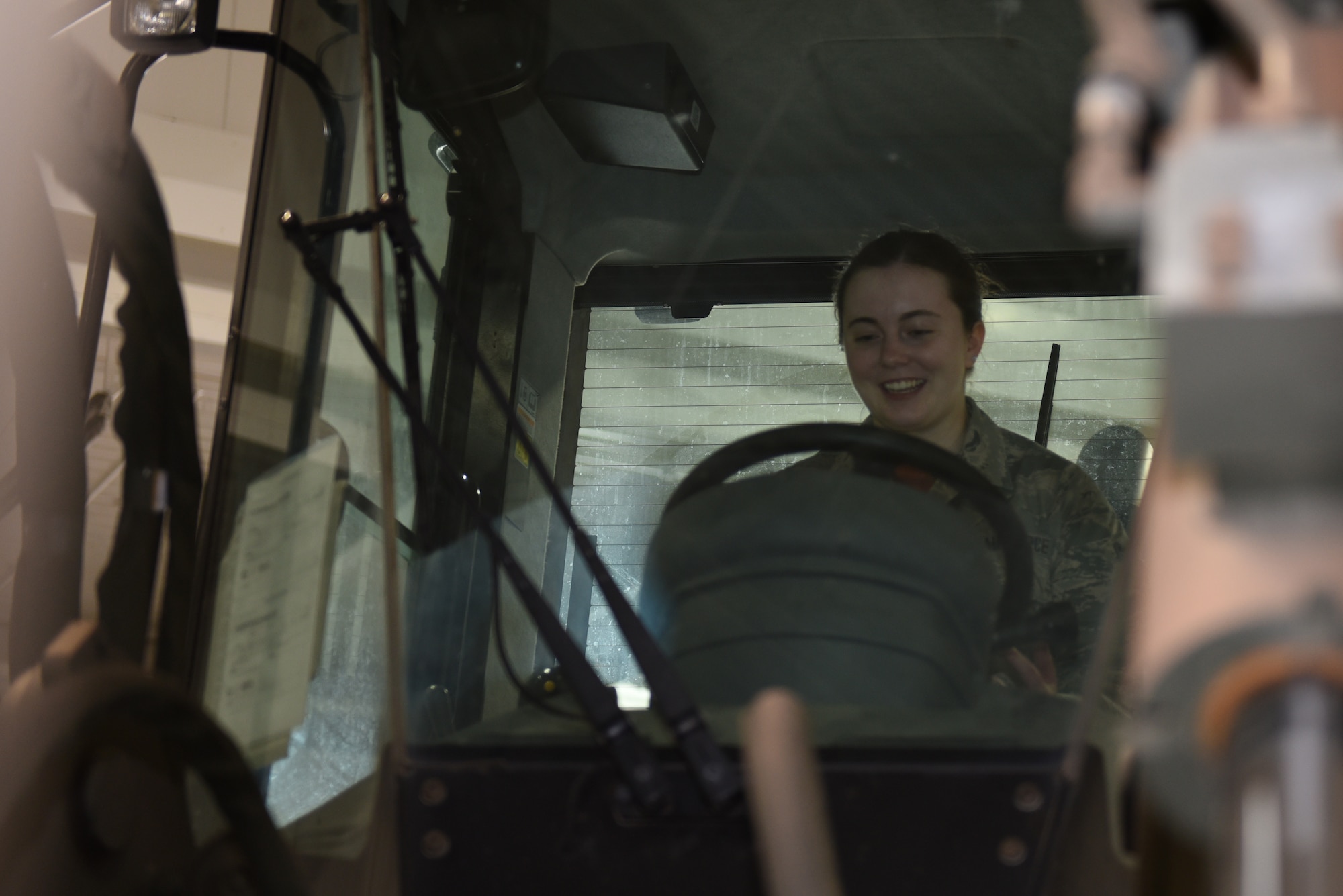U.S. Air Force Airman 1st Class Shanna Peluso, 60th Medical Operations Squadron physical medical technician, sits in a 10-KAT forklift during the Airmen Enrichment Program Sept. 27, 2019, at Travis Air Force Base, California. The program offers Airmen the opportunity to learn about the numerous specialties the Air Force has to offer. (U.S. Air Force photo by Airman 1st Class Cameron Otte)