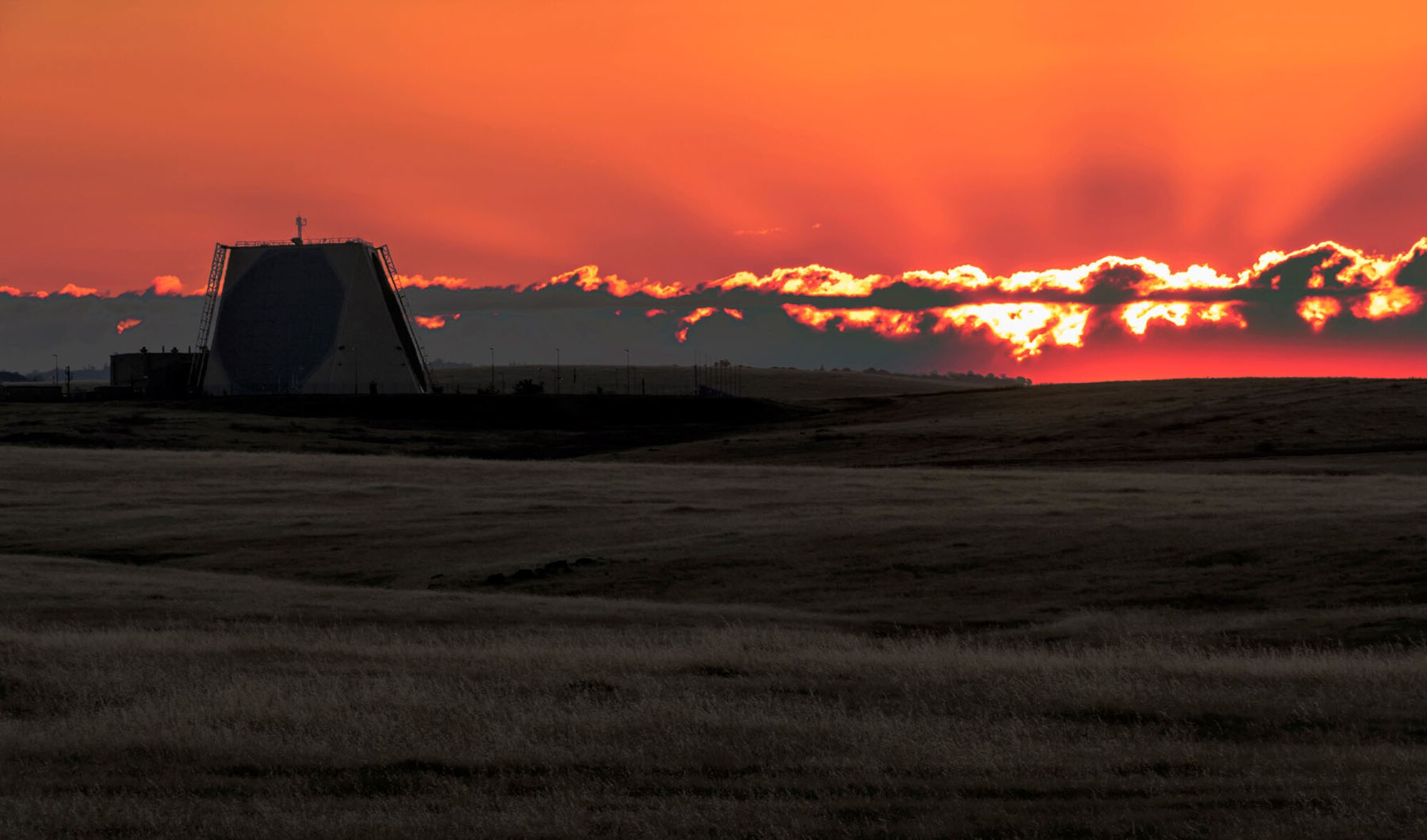 Sun sets behind UEWR at Beale Air Force Base, California.