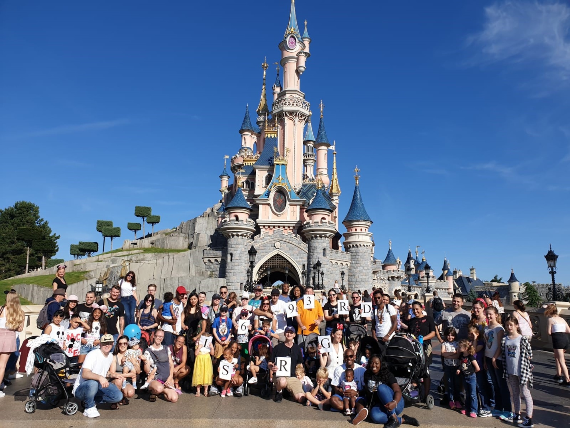 U.S. Air Force Airmen with the 693rd Intelligence, Surveillance, and Reconnaissance Group, and their families, pose for a group photo during a resiliency trip hosted by the Airmen Resiliency Team at Disneyland Paris, Aug. 23-25, 2019. The ART program at Ramstein Air Base, Germany, provides Airmen and families with events like marriage seminars and retreats. (Courtesy photo)