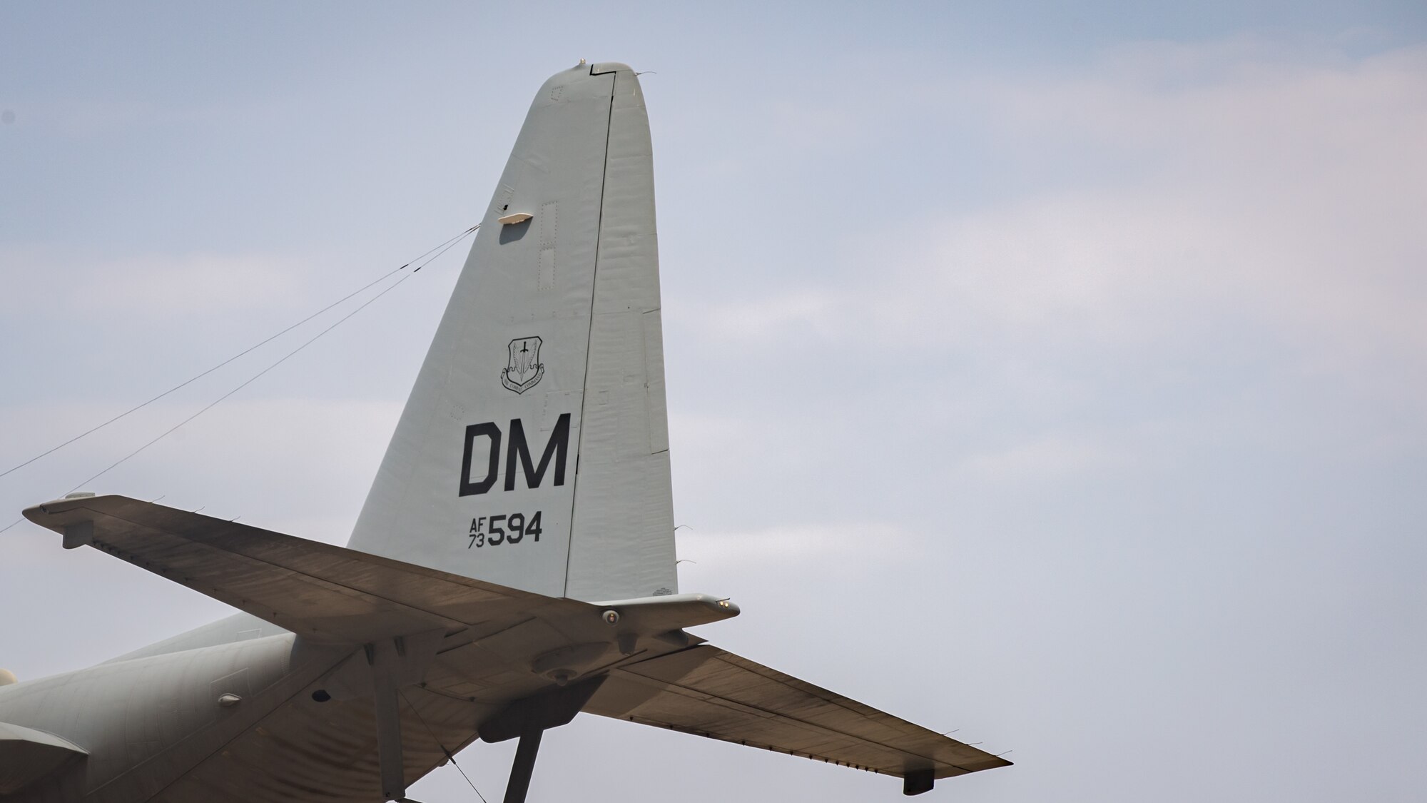 The tail code of a U.S. Air Force EC-130H Compass Call aircraft is shown as the aircraft await departure from Ali Al Salem Air Base, Kuwait, Oct. 2, 2019. The tail code is indicative of an aircraft's unit or base assignment, in this case, Davis-Monthan Air Force Base, Arizona. The aircraft's departure coincides with the inactivation of the 43rd Expeditionary Electronic Combat Squadron on Sept. 30, 2019. (U.S. Air Force photo by Tech. Sgt. Daniel Martinez)