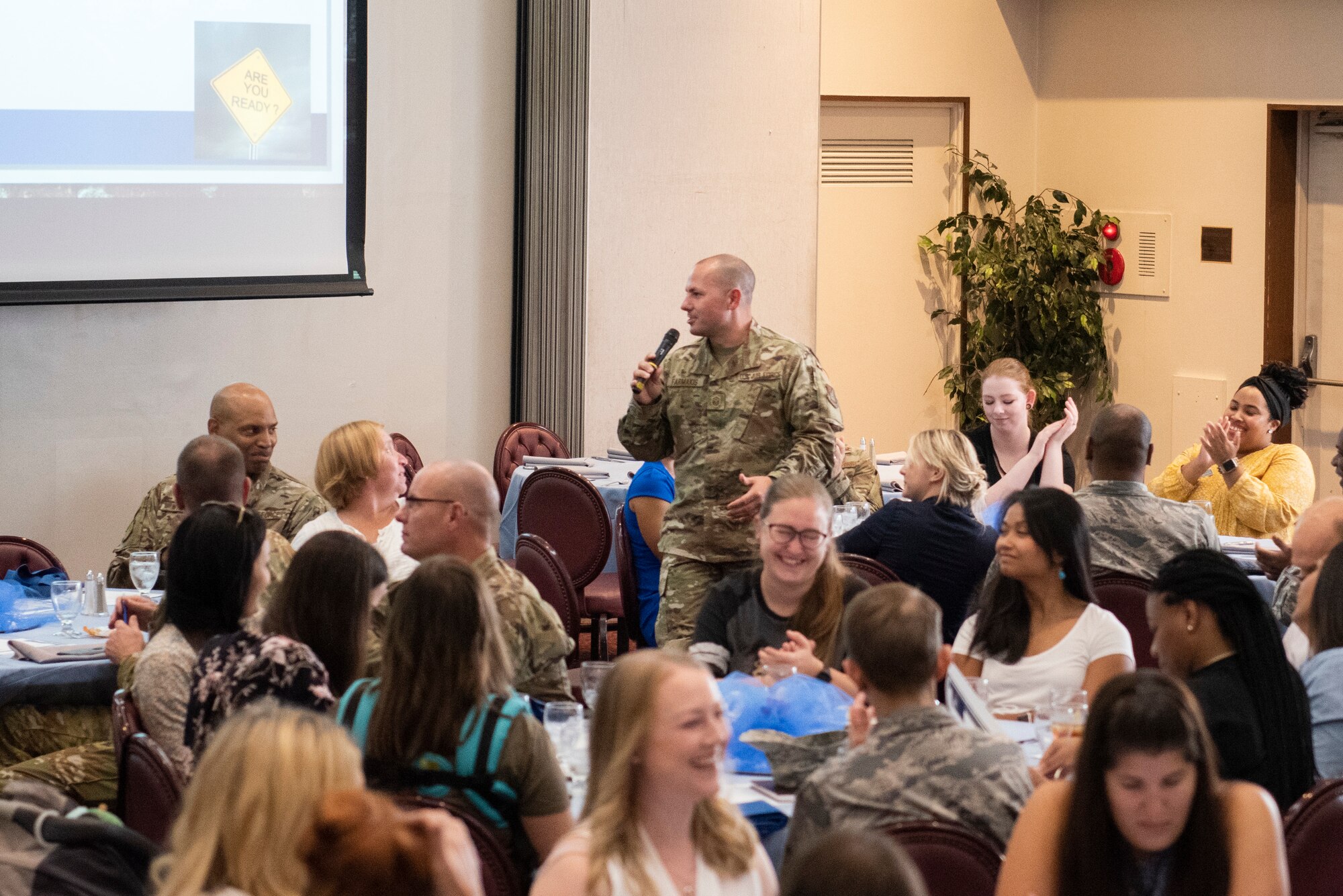 Participants in Key Spouse Kick-Off lunch and learn discuss various scenarios in groups on Oct. 2, 2019, at Yokota Air Base, Japan.