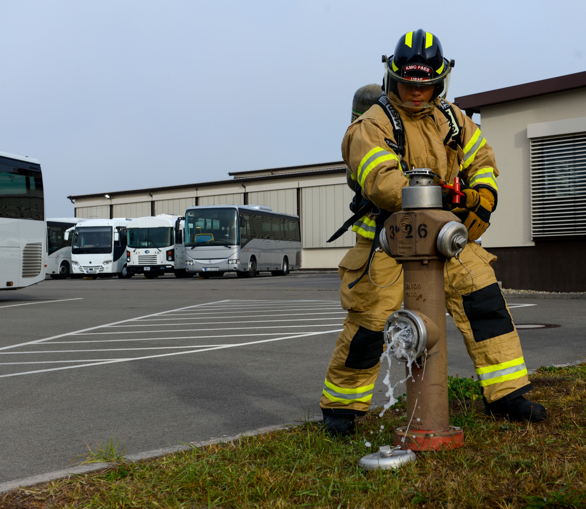 A U.S. Airman assigned to the 86th Civil Engineer Squadron releases water from a hydrant during a response to a simulated fire at Ramstein Air Base, Germany, Sept. 24, 2019. The simulated fire was an exercise inject for Operation Varsity 19-03, a weeklong exercise designed to test the capabilities of Ramstein Airmen. (U.S. Air Force photo by Tech. Sgt. Timothy Moore)