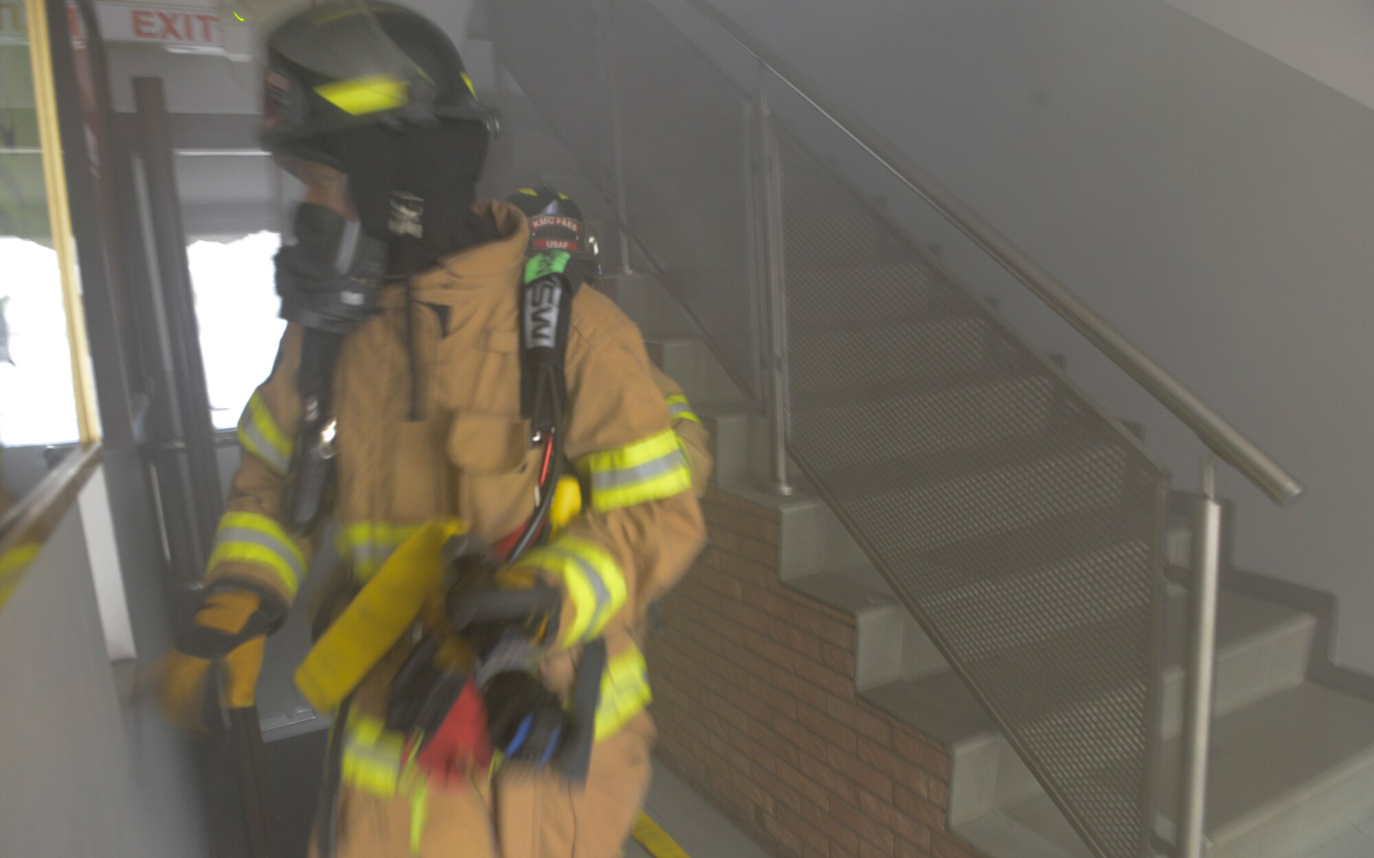 U.S. Airmen assigned to the 86th Civil Engineer Squadron survey a building during a response to a simulated fire at Ramstein Air Base, Germany, Sept. 24, 2019. The simulated fire was an exercise inject for Operation Varsity 19-03 and tested the response of various emergency response personnel throughout the week. (U.S. Air Force photo by Tech. Sgt. Timothy Moore)