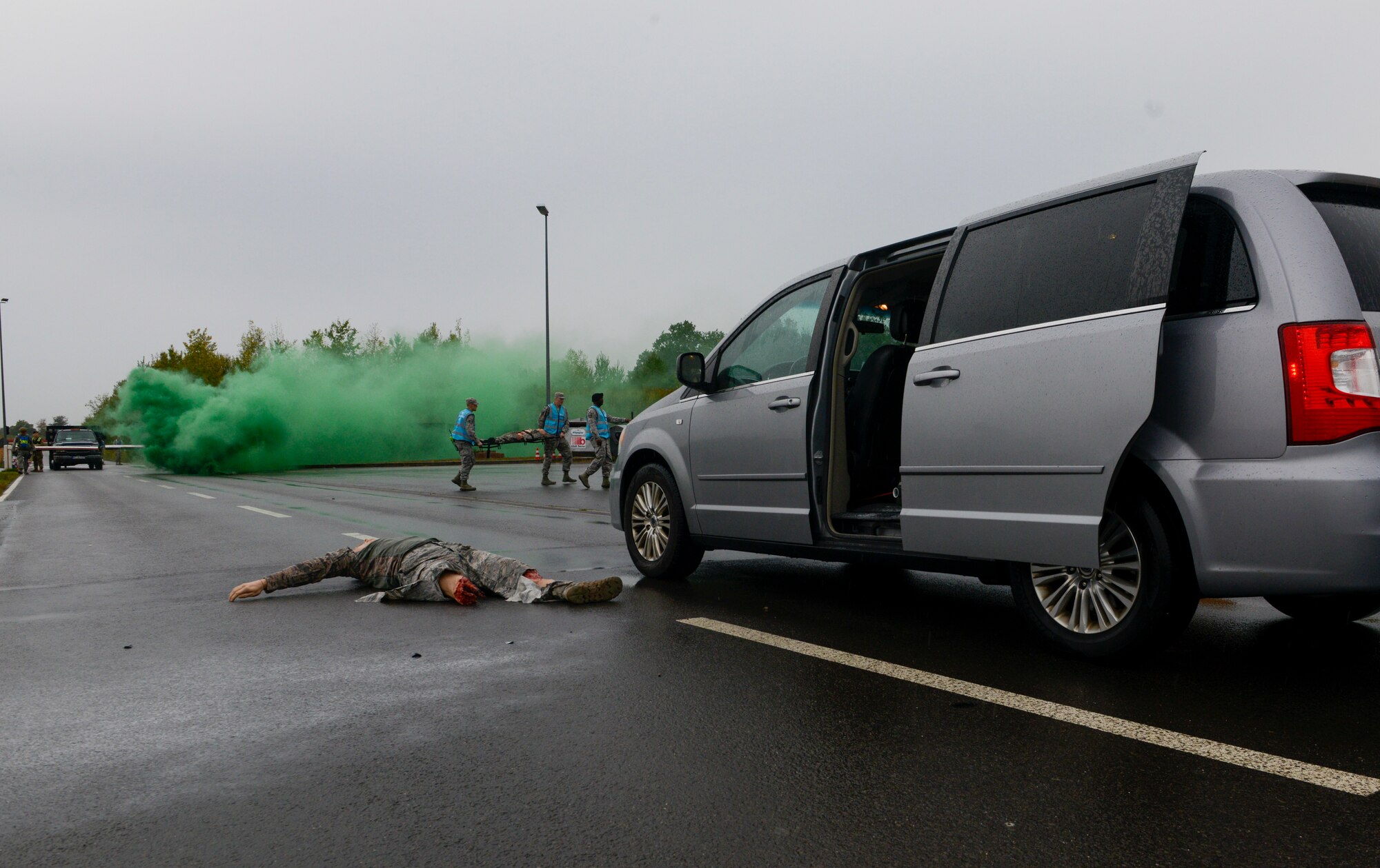 A training dummy lies on the ground after exercise players simulated rushing a gate entrance at Ramstein Air Base, Germany, Sept. 24, 2019. Organizers and inspectors for Operation Varsity 19-03 used dummies and gas to create realistic scenarios to test the capabilities of emergency personnel. (U.S. Air Force photo by Tech. Sgt. Timothy Moore)