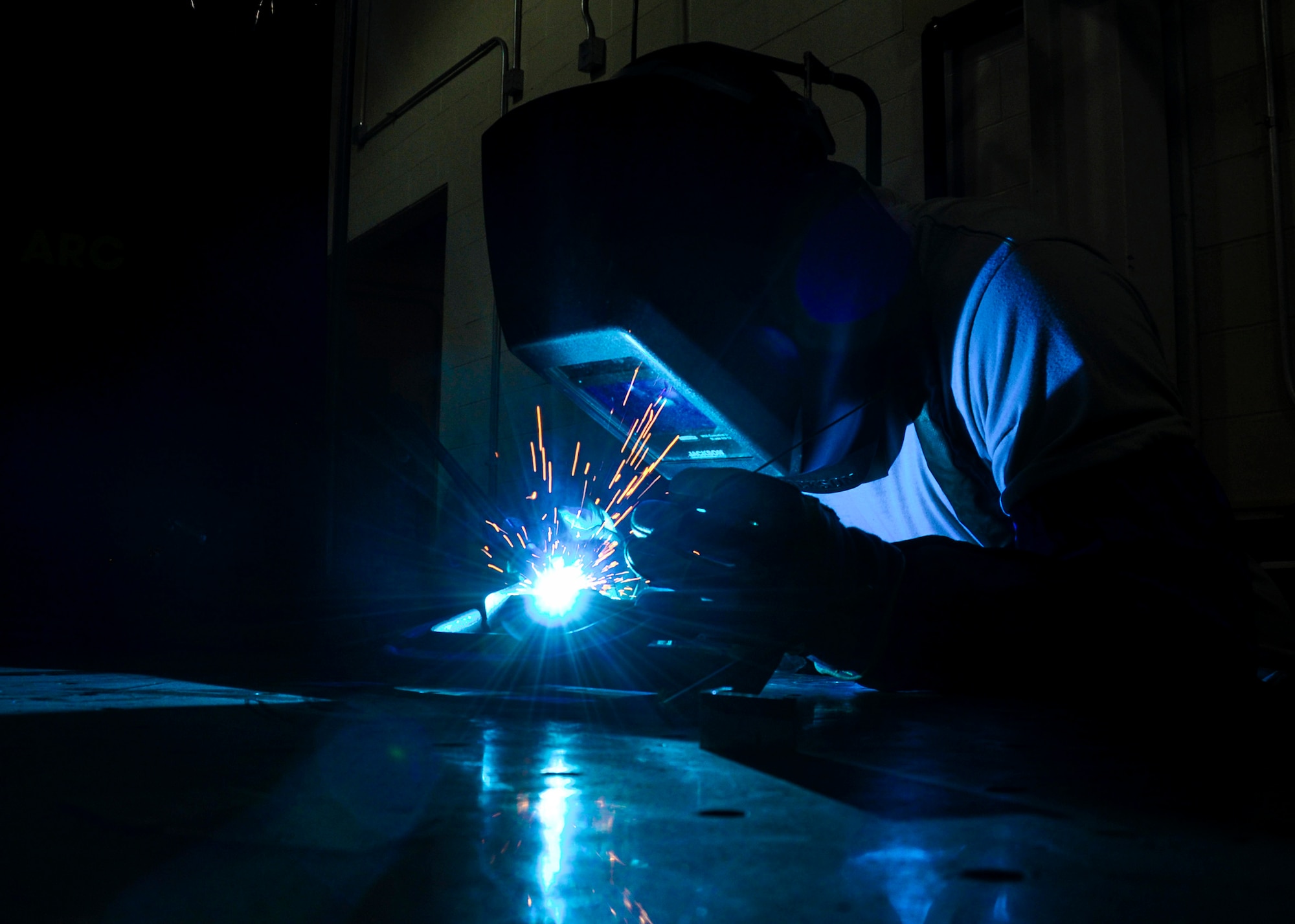 Tech. Sgt. Tyler L. Williams, 445th Maintenance Squadron, operates a tungsten inert gas welder at the metal technologies shop here Aug. 4, 2019. Williams is repairing damaged metal by using high amperage electrical current and melted tungsten to fuse the broken steel pieces, essentially “gluing” the tough materials together. (U.S. Air Force photo/Staff Sgt. Ethan Spickler)
