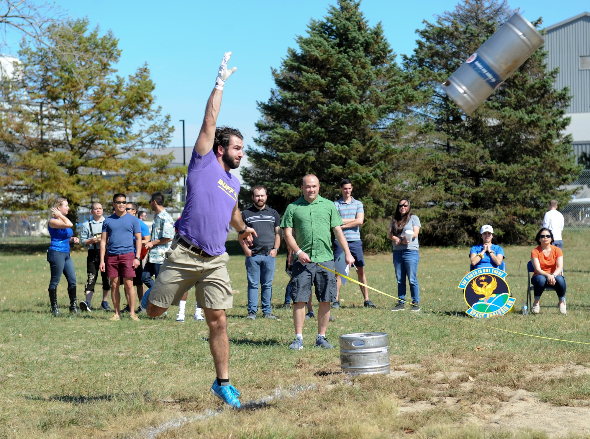 James Ross, National Air and Space Intelligence Center member, tosses a keg during the first round of the Keg Toss Competition at NASIC’s annual Oktoberfest at Bass Lake, Wright-Patterson Air Force Base, Ohio on Sept. 27, 2019. The keg toss had two rounds this year with the winner, Ross, throwing for a distance of nearly 44 feet. (U.S. Air Force photo by Senior Airman Samuel Earick/Released)