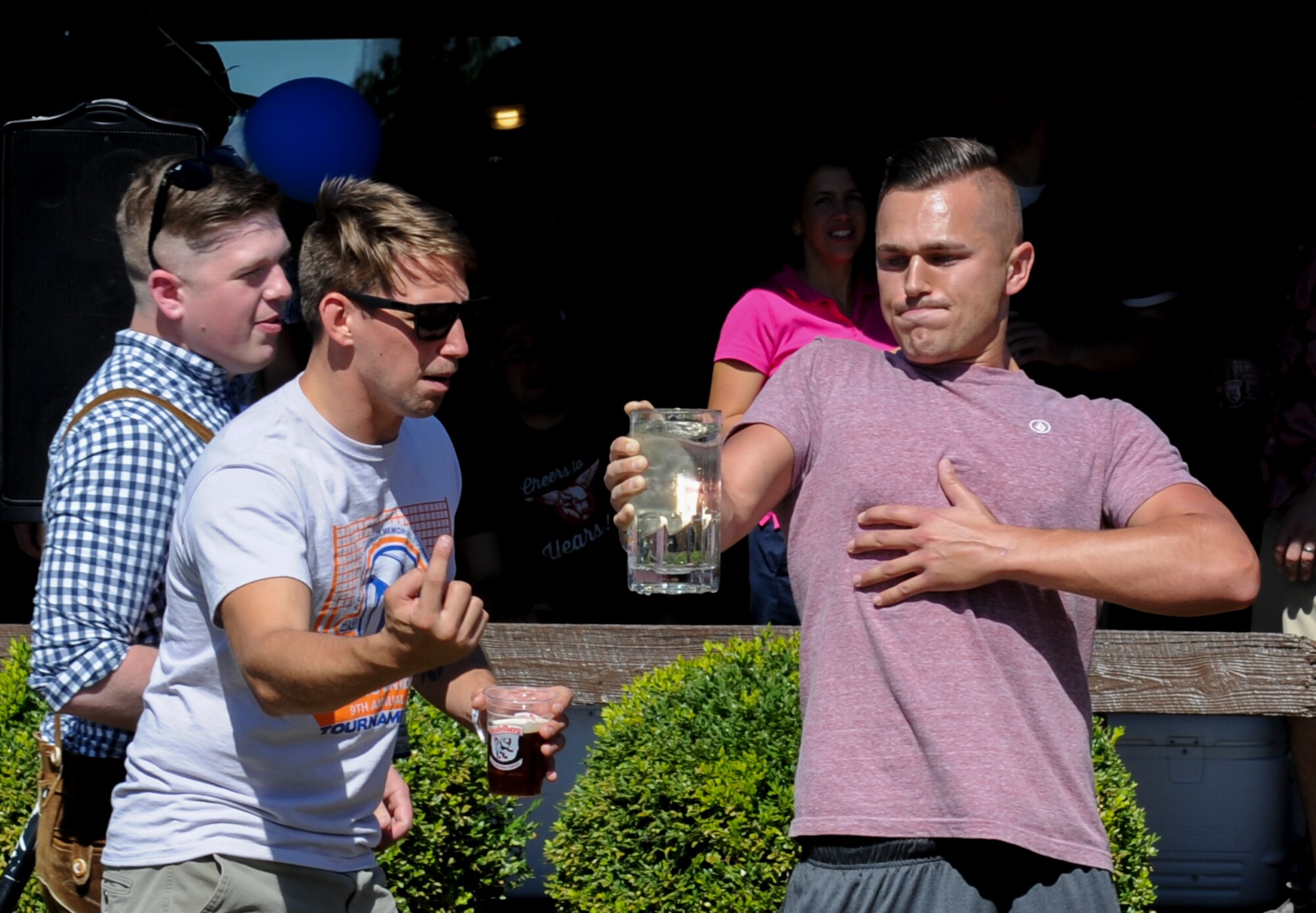 Senior Airmen Hunter Moore and Jason Fertig, National Air and Space Intelligence Center members, compete in the stein raising event during NASIC’s annual Oktoberfest at Bass Lake, Wright-Patterson Air Force Base, Ohio on Sep. 27, 2019. During the event, participants are challenged to see who holds their stein up the longest. (U.S. Air Force photo by Senior Airman Samuel Earick/Released)