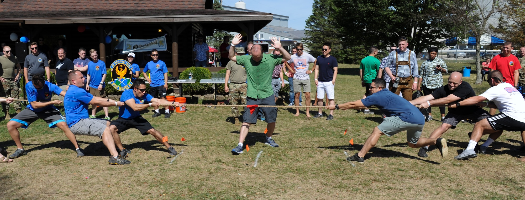 National Air and Space Intelligence Center members compete in a Tug-of-War event during NASIC’s annual Oktoberfest at Bass Lake, Wright-Patterson Air Force Base, Ohio on Sept. 27, 2019. The Air and Cyberspace Intelligence Group was declared the victors for the Oktoberfest games and claimed the prestigious Oktoberfest Cup. (U.S. Air Force photo by Senior Airman Samuel Earick/Released)