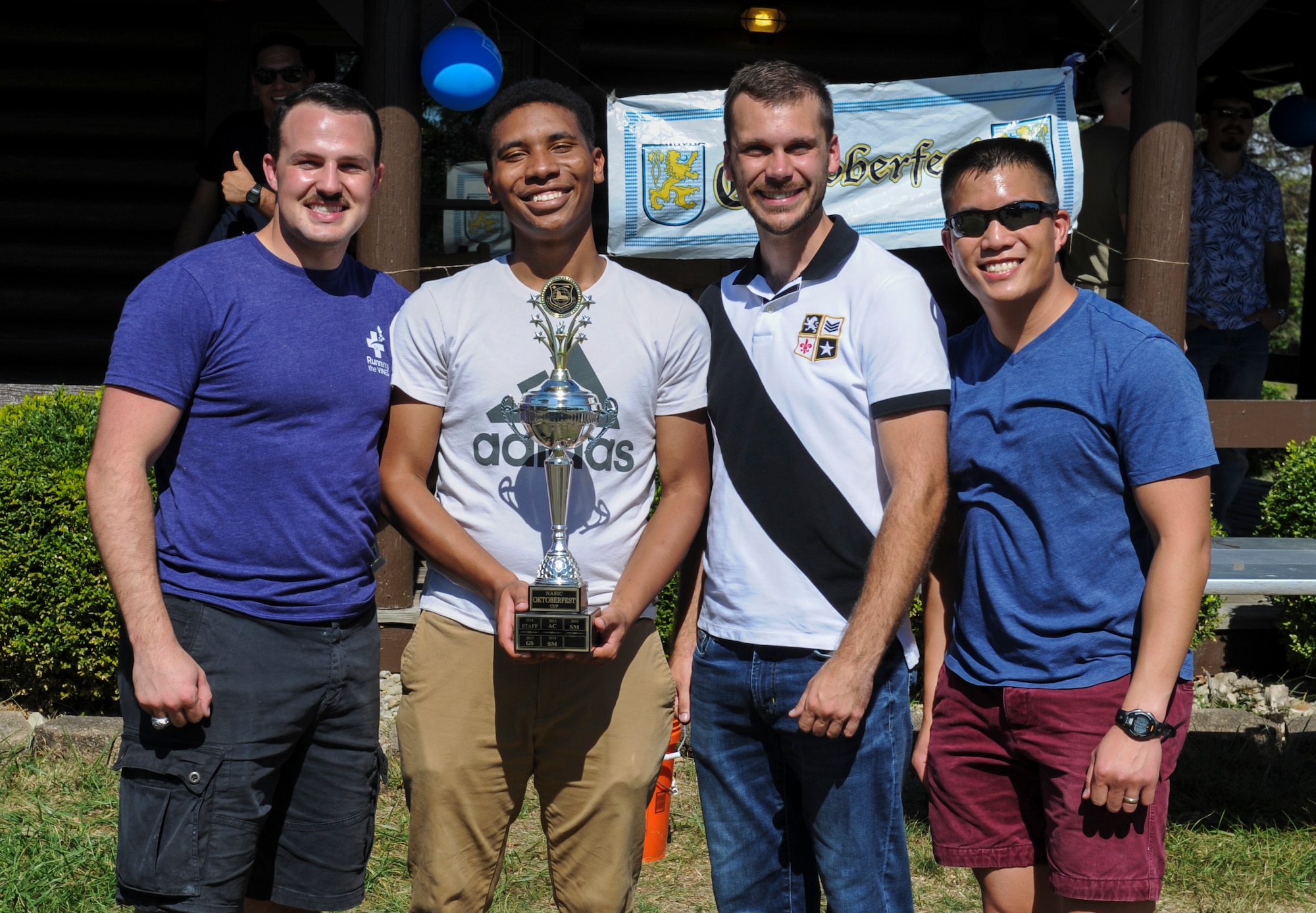 Air and Cyberspace Intelligence Group members celebrate their Oktoberfest Cup victory at Bass Lake, Wright-Patterson Air Force Base, Ohio on Sept. 27, 2019. The group gathered the most points earning them the 2019 top spot among the other NASIC groups. (U.S. Air Force photo by Senior Airman Samuel Earick/Released)