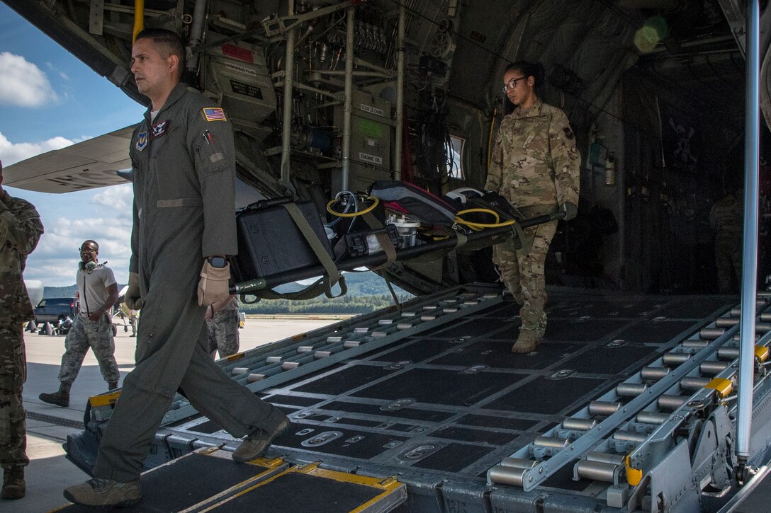 U.S. Air Force Airmen, assigned to the 86th Aeromedical Evacuation Squadron, Ramstein Air Base, conduct an Aeromedical Evacuation Exercise as a part of the Silver Arrow Mission in collaboration with the 179th Airlift Wing, Ohio Air National Guard, Sept. 13-14, 2019, from Ramstein Air Base to Naval Station Rota, Spain. Silver Arrow provides an augmenting force to increase tactical airlift capacity to U.S. Air Forces in Europe while improving the interoperability with NATO allies and partners. (U.S. Air National Guard photo by Airman 1st Class Alexis Wade)