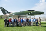 Vietnam veterans and 107th Attack Wing leadership pose for a group photograph in front of a static F-100 Super Sabre after a base tour of the 107th Attack Wing, New York Air National Guard, Niagara Falls Air Reserve Station, Sept. 15, 2019. Former Airmen assigned to the 107th Tactical Fighter Group reunited to commemorate their return from the Vietnam War more than 50 years ago. The unit deployed more than 400 Airmen to Tuy Hoa Air Base in 1968 and returned by June 1969, with honor.