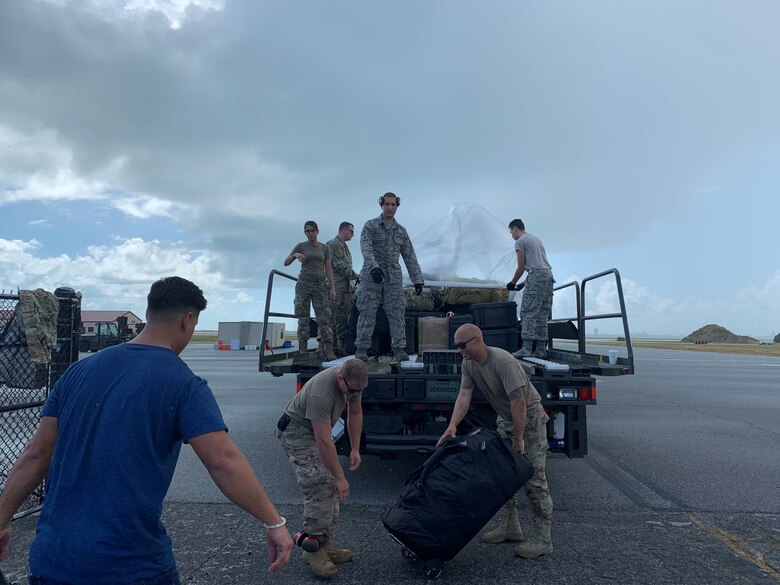 Reserve Citizen Airmen from the 920th Rescue Wing load bags.