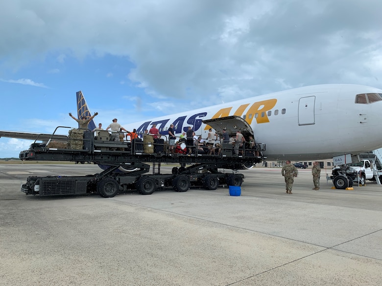 Reserve Citizen Airmen from the 920th Rescue Wing load an aircraft full of equipment and gear.