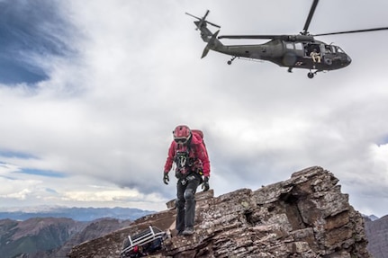 A UH-60 Black Hawk helicopter crew from the High-Altitude Army National Guard Aviation Training Site drops off a civilian rescue technician near the North Maroon Bells Peak near Aspen, Colorado, July 24, 2018. Colorado National Guard Soldiers at HAATS assist in about 20 rescue missions each year.