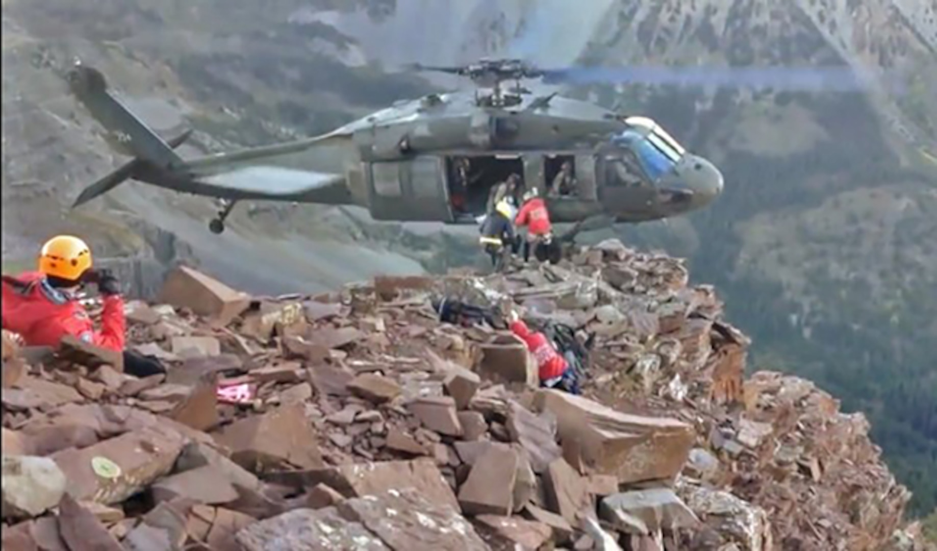 In this video still image, a UH-60 Black Hawk crew from the Colorado National Guard's High-Altitude Army National Guard Aviation Training Site perform a one-wheeled landing at or above 13,000 feet to rescue an injured hiker from Maroon Bells, Sept. 21, 2013.