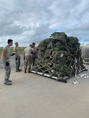 Reserve Citizen Airmen from the 920th Rescue Wing load an aircraft pallet