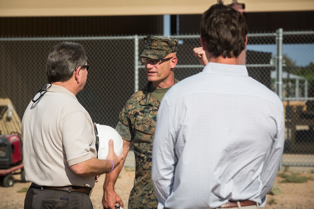 Col. David A. Suggs, the commanding officer of Marine Corps Air Station (MCAS) Yuma, John Courtis, MCAS Yuma's Auxiliary Commander and Executive Director of the Yuma County Chamber of Commerce, and other Yuma County Chamber of Commerce ambassadors shovel the first soil during the groundbreaking ceremony for the Flightline Marine Mart on MCAS Yuma, Ariz., Sept. 26, 2019. The Chamber of Commerce serves as the business voice of Yuma, advocating for both local businesses and local residents of Yuma. The new Marine Mart, set to open in 2020, will contain a barber shop, MCX shopping center, and will have a drive-thru. (U.S. Marine Corps photo by Sgt. Isaac D. Martinez)