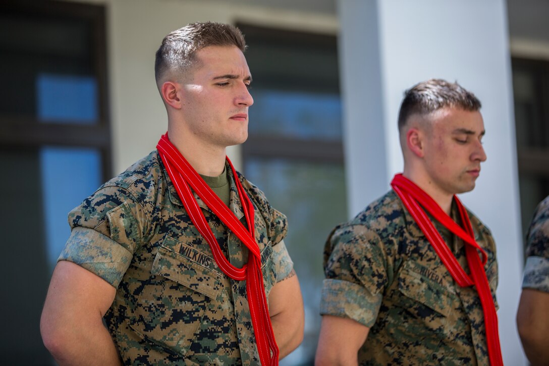 U.S. Marines assigned to Marine Corps Air Station (MCAS) Yuma, Headquarters and Headquarters Squadron (H&HS), recieve their blood stripe during the H&HS Blood Stripe Ceremony at MCAS Yuma, Ariz., Oct 1, 2019. The blood stripe honors the blood that was shed by Marine officers and noncommissioned officers (NCO) during the Battle of Chapultepec in 1847 and is worn on the trousers of NCO's, Staff NCO's, and officers in rememberance of those who courageously fought in the battle. (U.S. Marine Corps photo by Lance Cpl. John Hall)