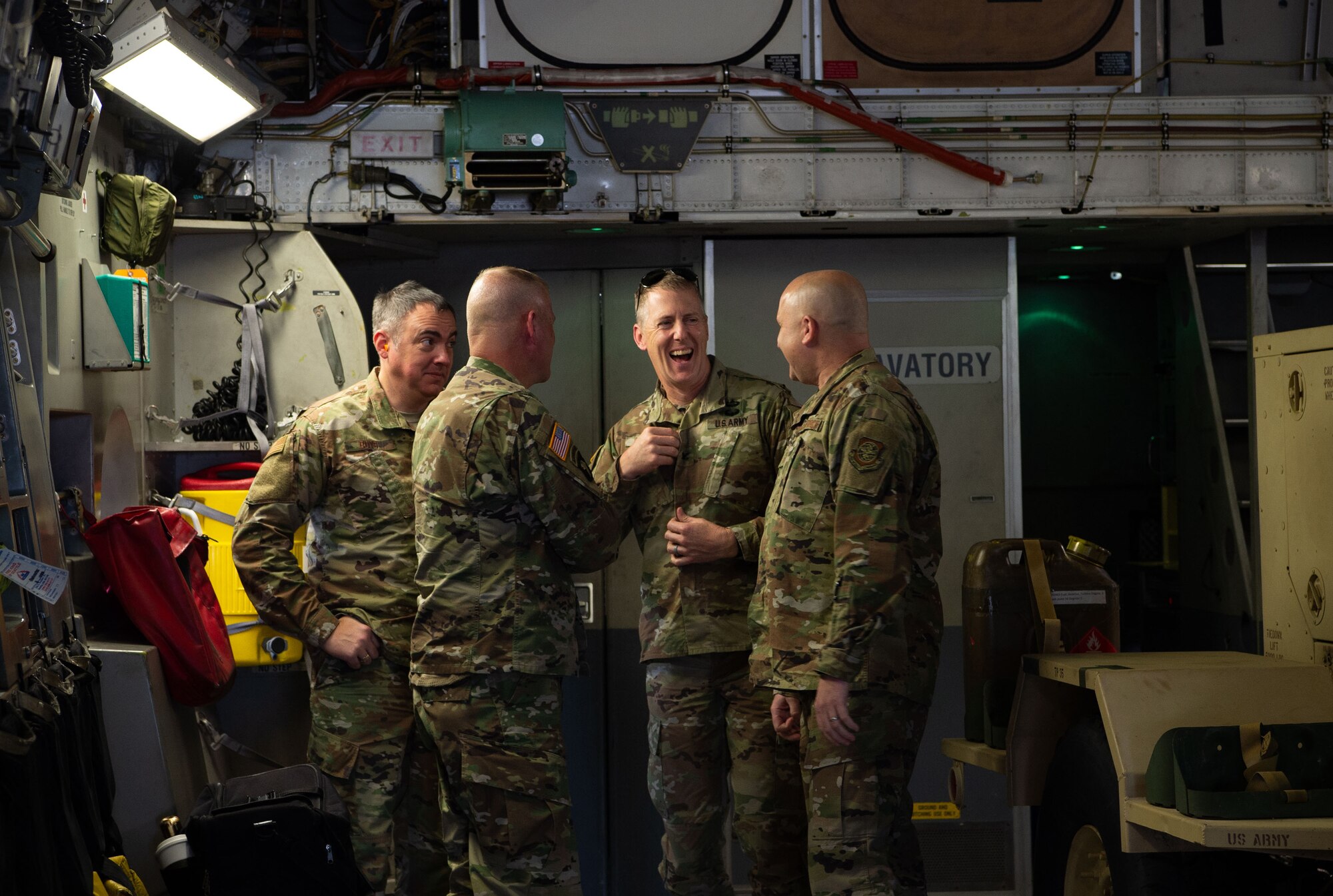 From right, U.S. Air Force Chief Master Sgt. Robert Schultz, 62nd Airlift Wing command chief; U.S. Army Col. Skye Duncan, Joint Base Lewis-McChord (JBLM) commander; U.S. Army Command Sgt. Maj. Timothy Marble, JBLM command sergeant major; and U.S. Air Force Chief Master Sgt. Joel Buys, JBLM senior enlisted leader and 627th Air Base Group command chief, talk onboard a C-17 Globemaster III at JBLM, Wash., Oct. 1, 2019. The purpose of the flight was to provide training opportunities for Soldiers assigned to the 51st Expeditionary Signal Battalion, 35th Signal Brigade, and 7th Airlift Squadron pilots and loadmasters. (U.S. Air Force photo by Senior Airman Tryphena Mayhugh)