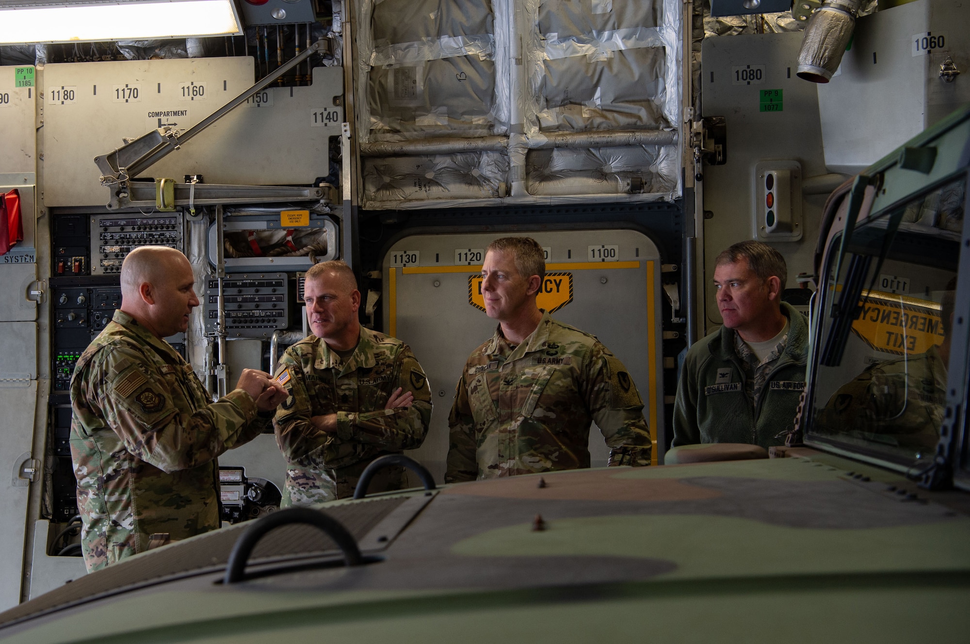 From left, U.S. Air Force Chief Master Sgt. Robert Schultz, 62nd Airlift Wing command chief; U.S. Army Command Sgt. Maj. Timothy Marble, Joint Base Lewis-McChord (JBLM) command sergeant major; U.S. Army Col. Skye Duncan, JBLM commander; and U.S. Air Force Col. Patrick O’Sullivan, JBLM vice commander and 627th Air Base Group commander, witness how U.S. Air Force loadmasters and U.S. Army Soldiers work together to offload Army equipment from a C-17 Globemaster III at Moses Lake Municipal Airport, Wash., Oct. 1, 2019. The purpose of the flight was for Soldiers from the 51st Expeditionary Signal Battalion, 35th Signal Brigade, to test their long-range communication equipment from Moses Lake to JBLM for a mobility movement exercise. (U.S. Air Force photo by Senior Airman Tryphena Mayhugh)