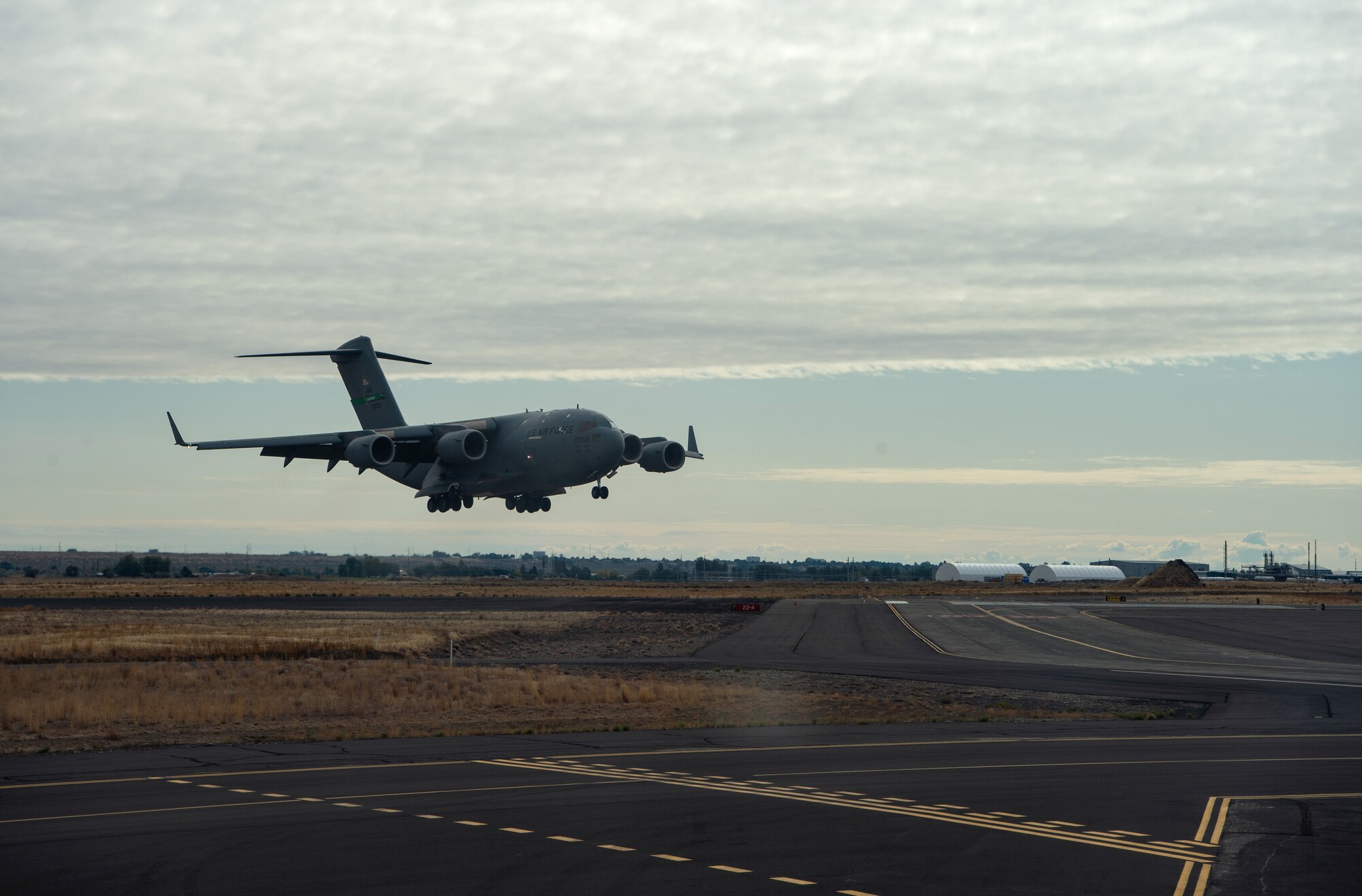 A C-17 Globemaster III comes in to land at Moses Lake Municipal Airport, Wash., Oct. 1, 2019. Two C-17s from McChord Field flew to Moses Lake to train Air Force pilots on a variety of aircraft landings and for Army Soldiers to test their long-range communication equipment. (U.S. Air Force photo by Senior Airman Tryphena Mayhugh)