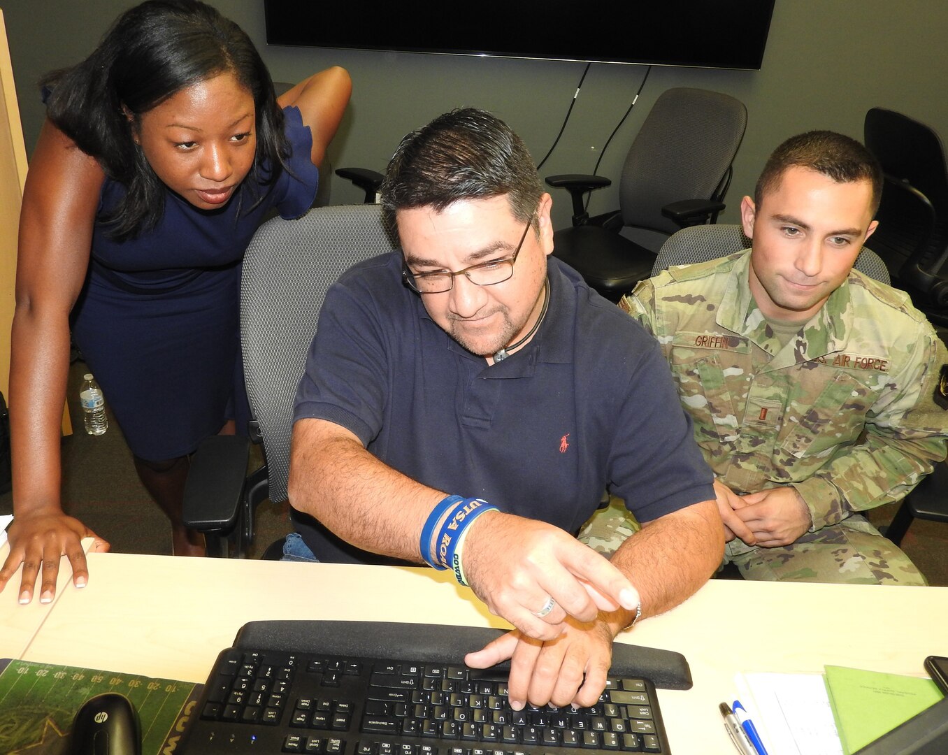 As 30 budget analysts and financial experts gathered at Air Force Installation and Mission Support Center headquarters at Joint Base San Antonio-Lackland to close out the fiscal year, 2nd Lt. Paul Griffin and Emerald Lundy, budget officers from Hanscom Air Force Base, Massachusetts, received a behind the scenes look at AFIMSC and end of year operations from Felix Saenz, AFIMSC budget analyst.