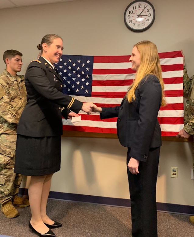 Dr. Janice McDaniel shakes hands with Lt. Col. Gwyneth Hughes after taking the Oath of Commissioned Officers. McDaniel commissioned as a major into the U.S. Army Reserve. Both McDaniel and Hughes work at Akron Children's Hospital.