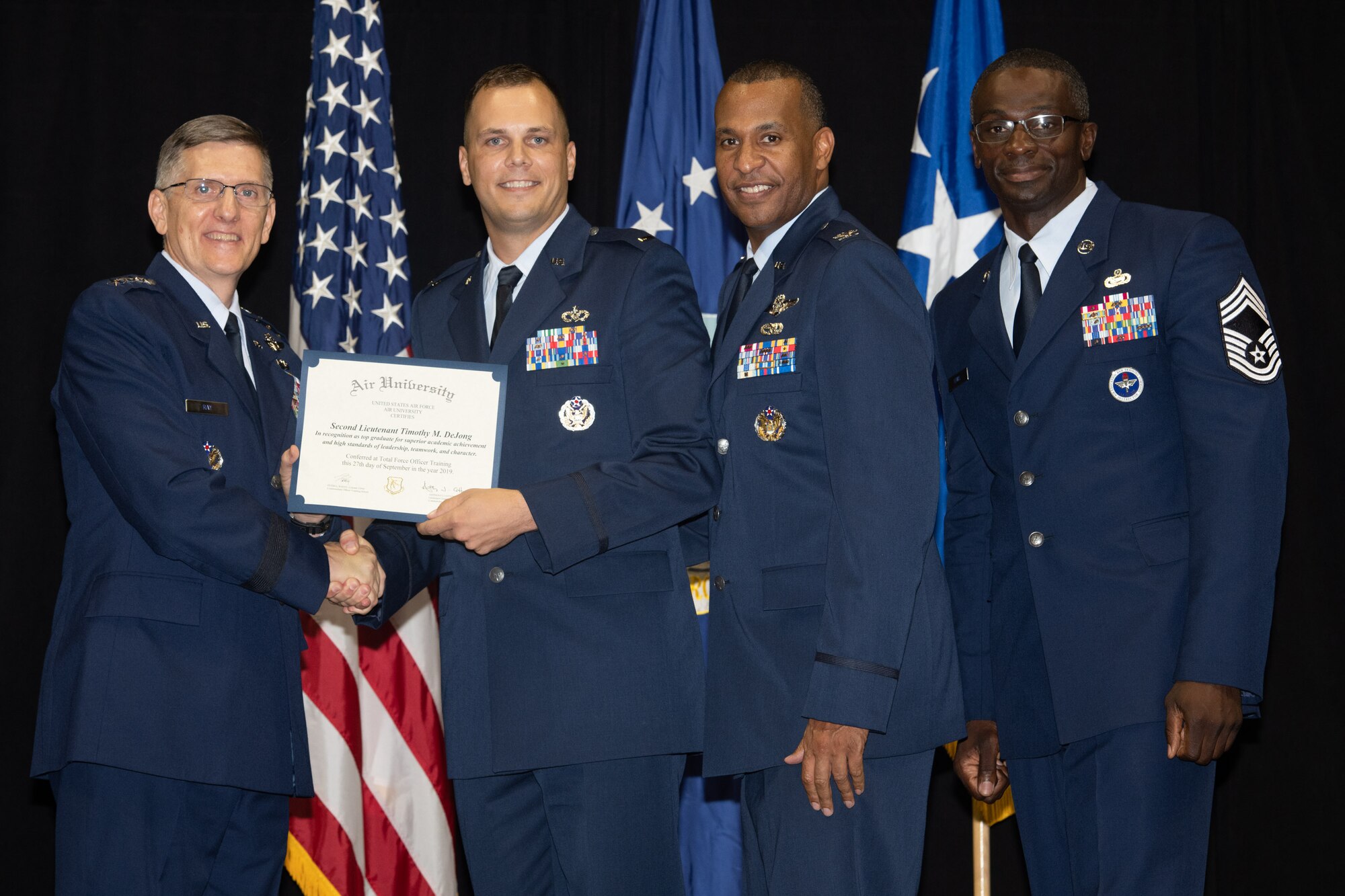 Gen. Tim Ray, Air Force Global Strike Command commander, presents the top graduate award for Detachment 12 to 2nd Lt. Timothy Dijone from Air University’s Officer Training School “Godzilla” class 19-07 during an awards ceremony at the Alabama State University Acadome, Montgomery, Ala., Sept. 26, 2019. Class 19-07, dubbed internally as “Godzilla,” started with more than 800 officer trainees, effectively double the average class size.