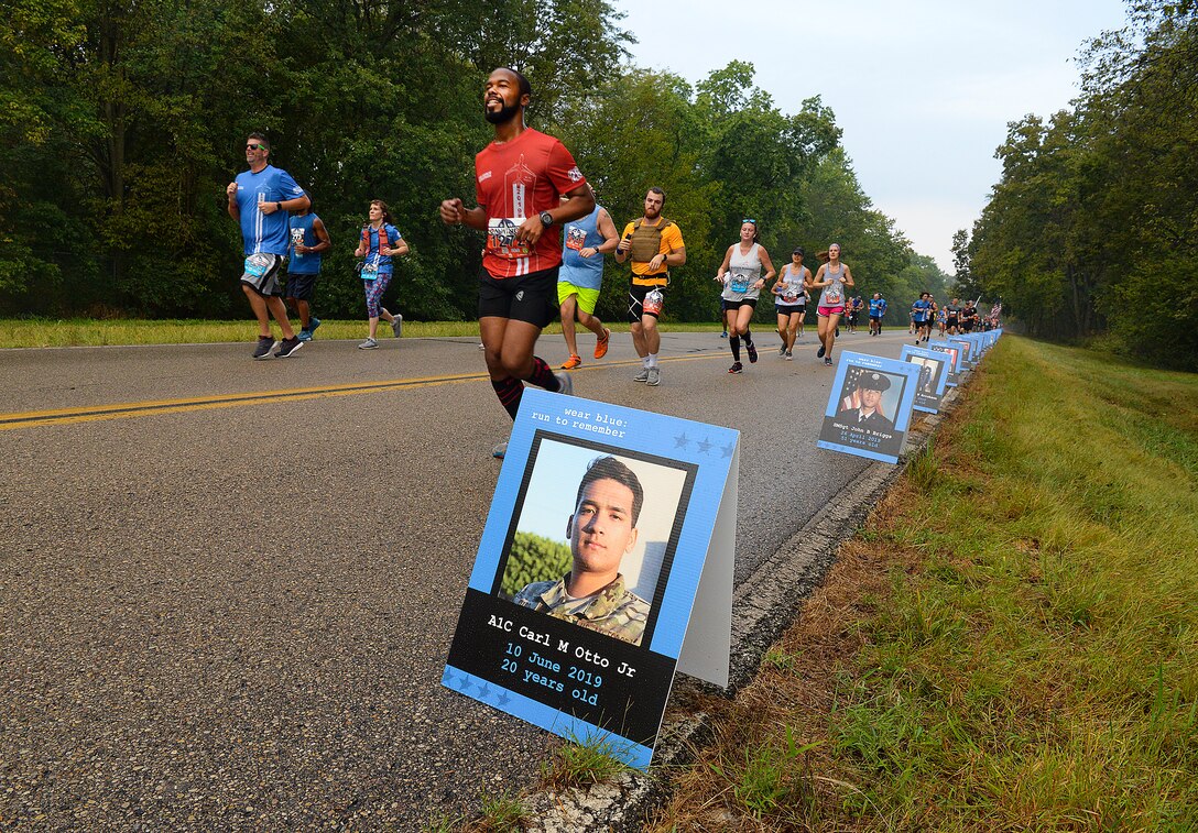 The Blue Mile was added to this year’s Air Force Marathon on Sept. 21. Wear blue: run to remember, a nonprofit running community that honors the service and sacrifice of military members, set up a mile long memorial with American flags and photographs to honor the fallen. (U.S. Air Force photo/R.J. Oriez)