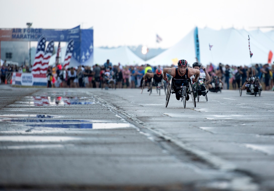 Wheeled race competitors take off from the start line at the Air Force Marathon on Sept. 21 at Wright-Patterson AFB, Ohio.  Brandon Hough, Air Force Marathon director plans to incorporate more inclusivity for athletes with disabilities at future marathons. (U.S. Air Force photo/Michelle Gigante)