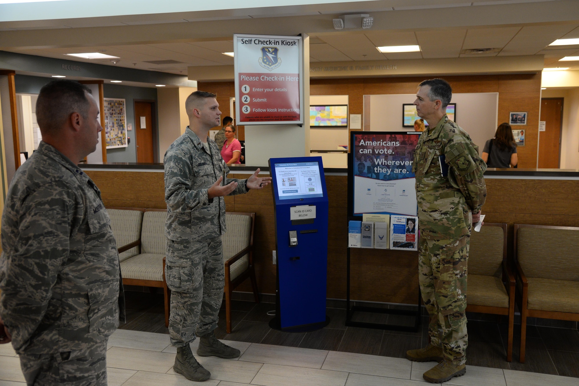 Maj. Gen. Craig Wills, 19th Air Force commander, and 2nd Lt. Brandon Solomon, 14th Healthcare Operations Squadron TOPA flight chief, speak about the benefits and time savings of the 14th Medical Group self-check in kiosk systems, Oct. 1, 2019, on Columbus Air Force Base, Miss. During Wills’ visit, he spoke with key members of different squadrons about innovative ways they are making the base and its systems better. (U.S. Air Force photo by Airman 1st Class Jake Jacobsen)