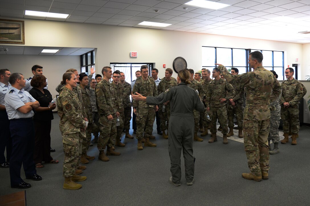 Maj. Gen. Wills, 19th Air Force commander, and Col. Samantha Weeks, 14th Flying Training Wing commander, speak to new members of Team BLAZE, Oct. 1, 2019, on Columbus Air Force Base, Miss. The recently changed newcomer’s tour is a way Columbus AFB gives its new students and permanent party residents a full tour of Columbus AFB while providing crucial information about the area. (U.S. Air Force photo by Airman 1st Class Jake Jacobsen)