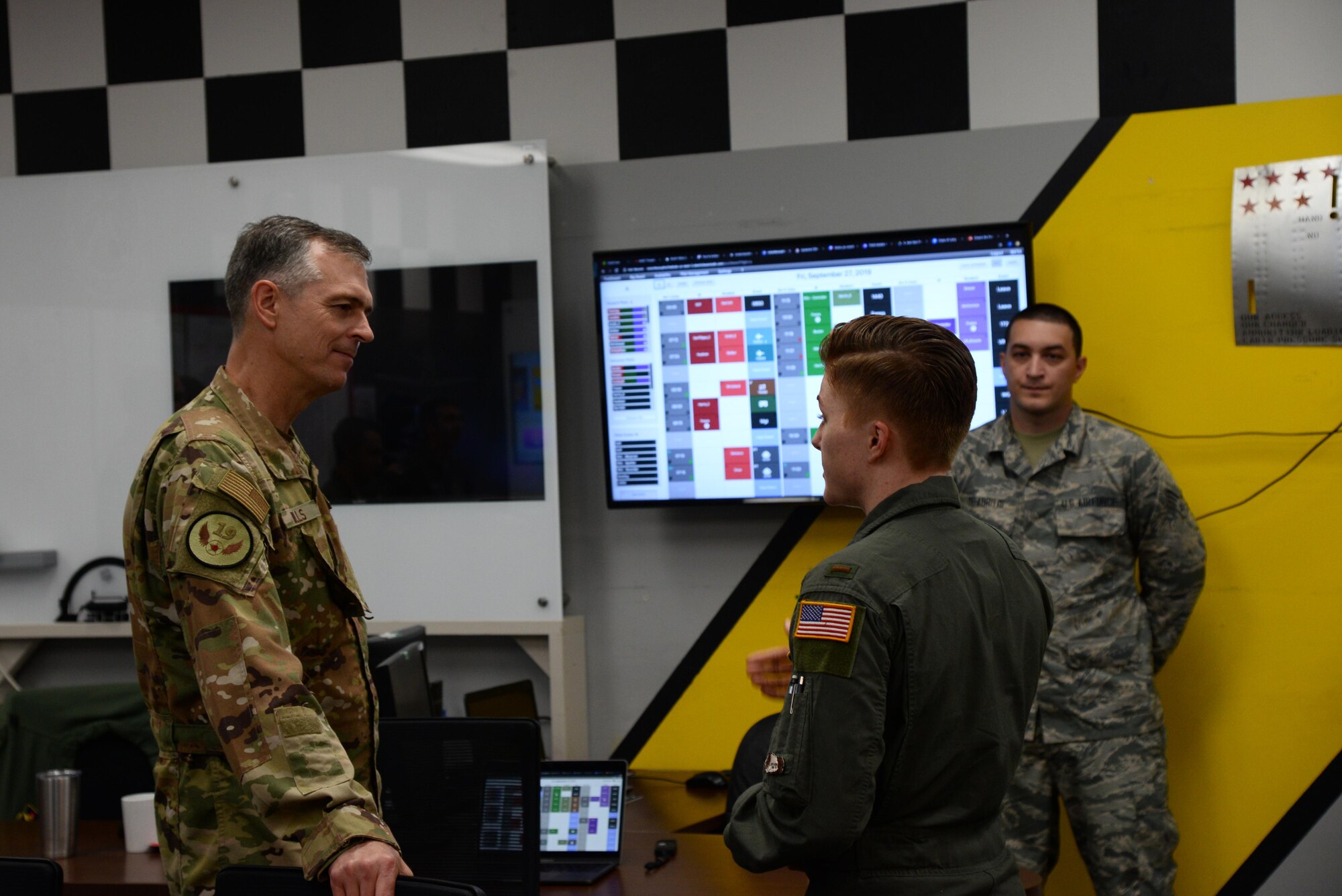 Maj. Gen. Craig Wills, 19th Air Force commander, and 2nd Lt. Michelle Strickland, 37th Flying Training Squadron student pilot, discuss her recent achievements in the 2019 Inter Service Alpha Warrior Final Battle Oct. 1, 2019, on Columbus Air Force Base, Miss. For Strickland’s recent achievements in the Alpha Warrior competition, she was recognized as an outstanding member of her squadron and was later coined by Wills. (U.S. Air Force photo by Airman 1st Class Jake Jacobsen)