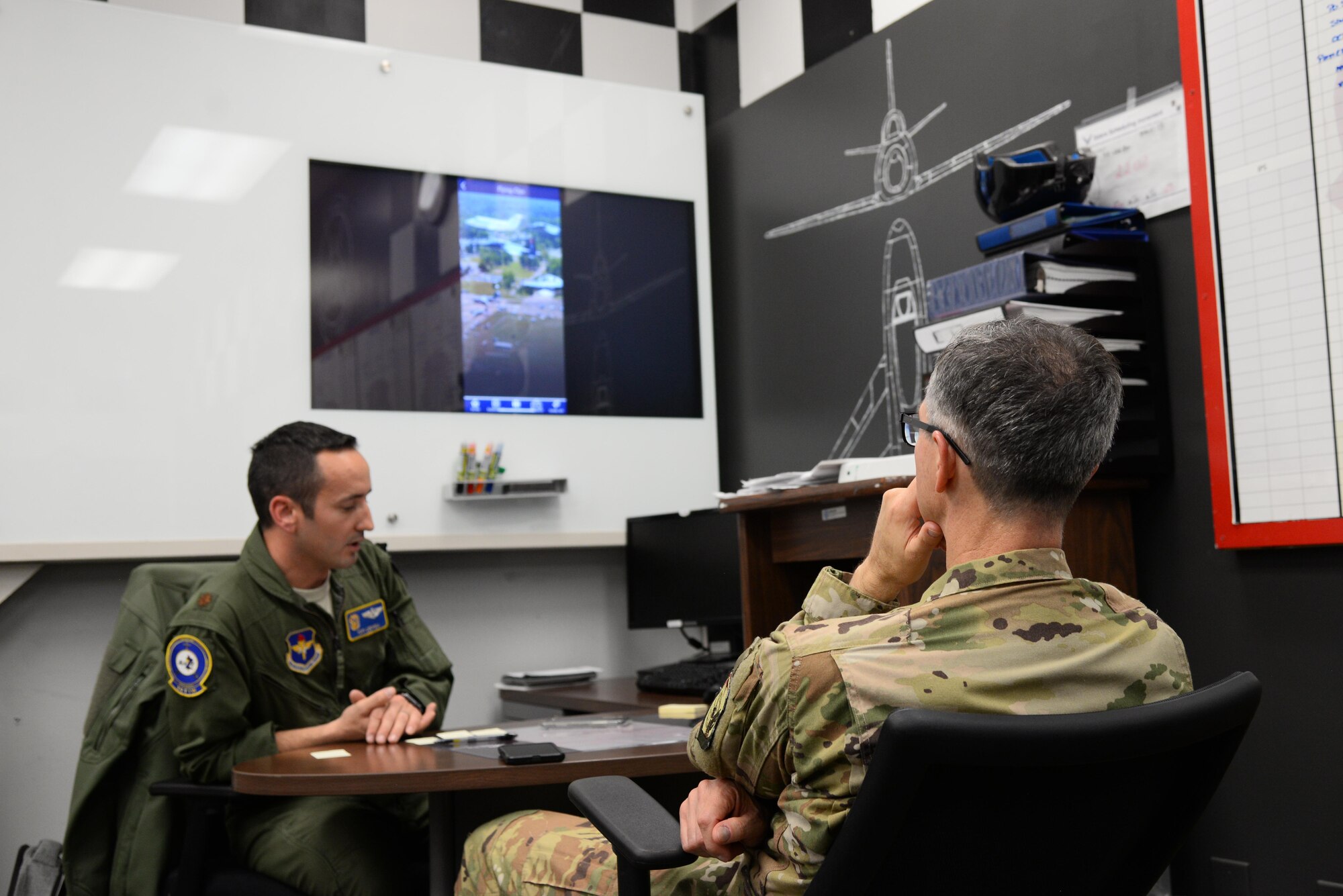 Maj. Gen. Craig Wills, 19th Air Force commander, is briefed about the Columbus Air Force Base mobile app by Maj. Tory Lodmell, 14th Flying Training Wing Commander’s Action Group director, Oct. 1, 2019, on Columbus Air Force Base, Miss. The app was designed for members of team BLAZE to have pertinent information about the base including a directory, map, activities and pop up notifications. (U.S. Air Force photo by Airman 1st Class Jake Jacobsen)