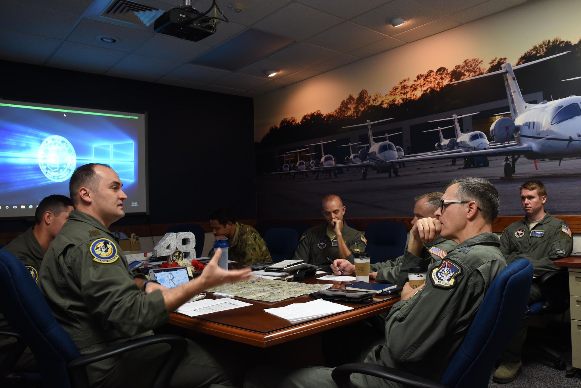 Maj. Gen. Wills, 19th Air Force commander, receives a briefing from members of the 48th Flying Training Squadron before a T-1 Jayhawk flight Oct. 2, 2019, on Columbus Air Force Base, Miss. One of the highlights of the visit for Wills was flying with the 48th Flying Training Squadron in the T-1 Jayhawk out of the Golden Triangle Regional Airport. (U.S. Air Force photo by Airman 1st Class Jake Jacobsen)