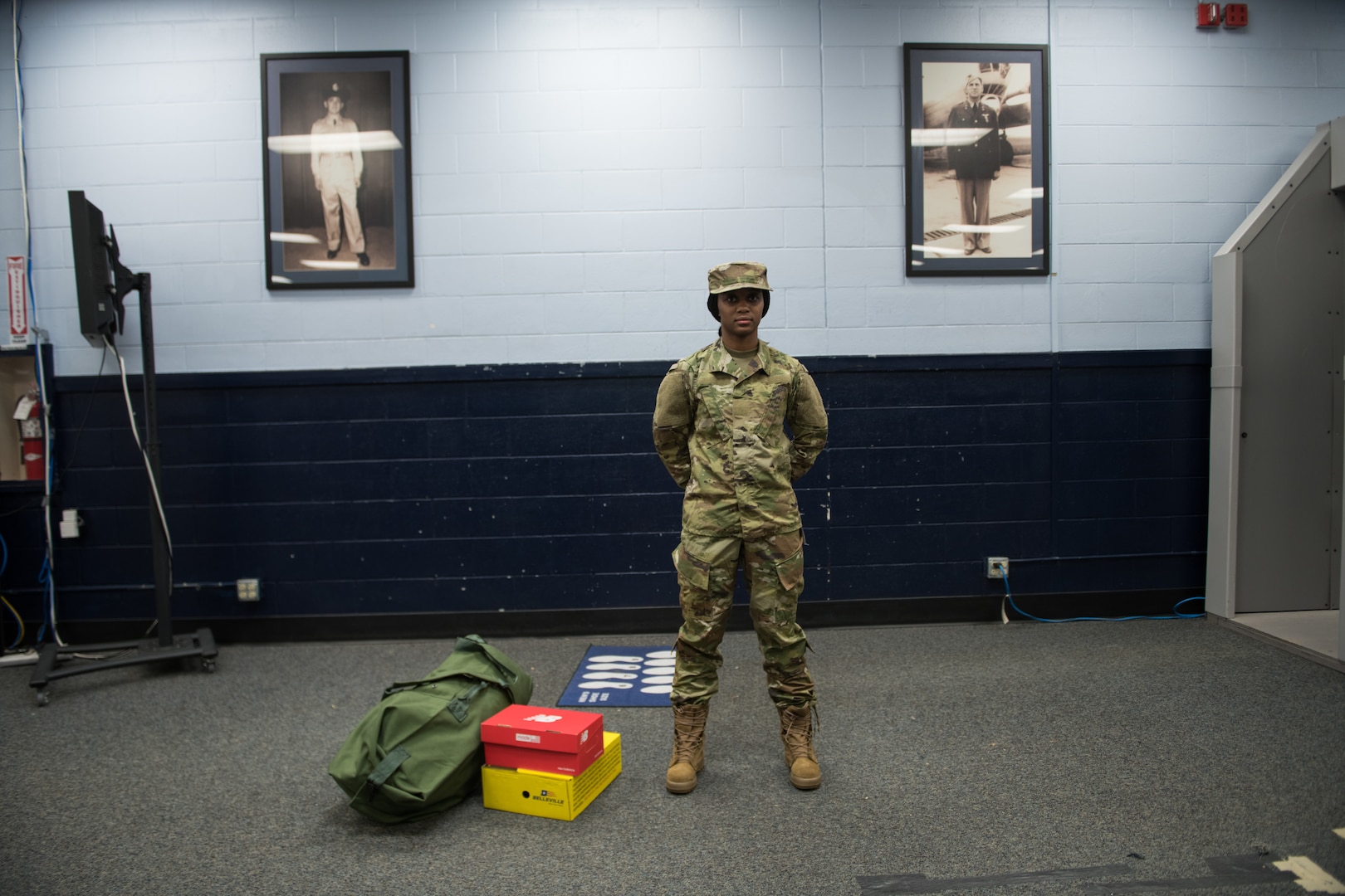 U.S. Air Force basic military training trainee Corvonda Traylor, 326th Training Squadron, female flight, receives the first operational camouflage pattern (OCP) uniforms during initial issue, Oct. 2, 2019, at Joint Base San Antonio-Lackland, Texas.