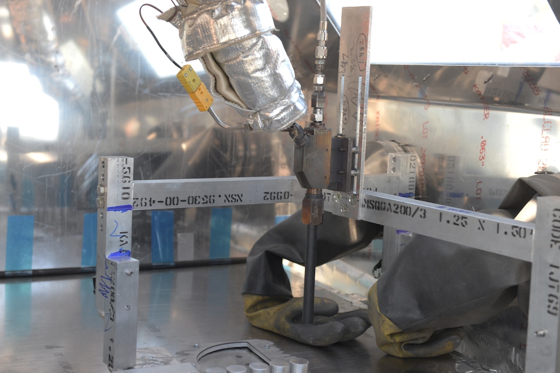 The 28th Maintenance Squadron Additive Manufacturing Rapid Repair Facility section conducted its first-ever Cold Spray repair on a B-52 Stratofortress static display at the South Dakota Air and Space Museum in Box Elder, S.D., Sept. 18, 2019. The GEN III High-Pressure Cold Spray unit uses helium gas to accelerate spherical aluminum particles to bond with the surface needing repaired. (U.S. Air Force photo by Airman Quentin K. Marx)