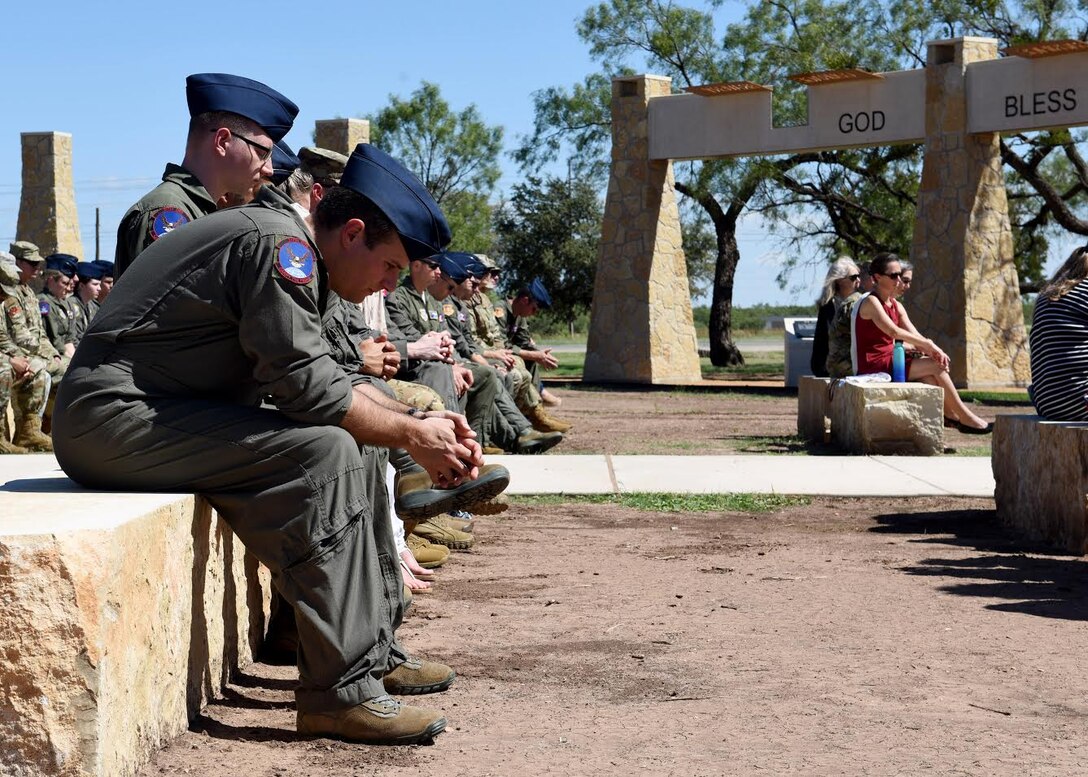 Airmen assigned to Dyess Air Force Base, Texas, bow their heads during a moment of silence for the fallen during the TORQE 62 Memorial Ceremony in Abilene, Texas, Oct. 2, 2019.
