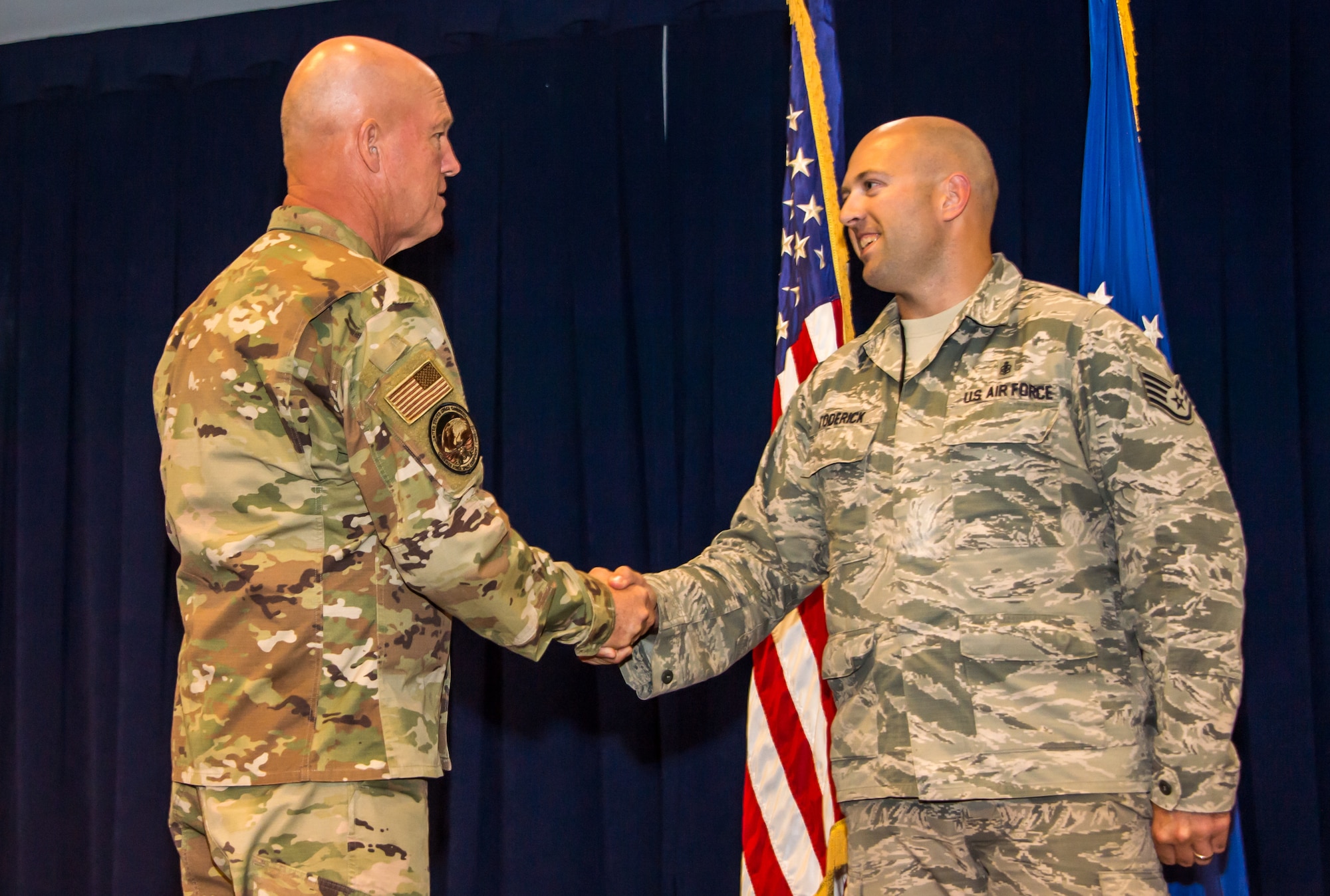 Gen. Jay Raymond, U.S. Space Command and Air Force Space Command commander, coins Staff Sgt. Michael Toderick, 61st Medical Squadron’s non-commissioned officer in charge of community health, while visiting the Space and Missile Systems Center (SMC), Los Angeles Air Force Base, El Segundo, Calif., Oct. 1, 2019. During his visit, Gen. Raymond spoke with Airmen about the recent standup of U.S. Space Command and the critical role SMC plays in speeding up the acquisition process and delivering space capabilities.

 (U.S. Air Force photo by Van De Ha)