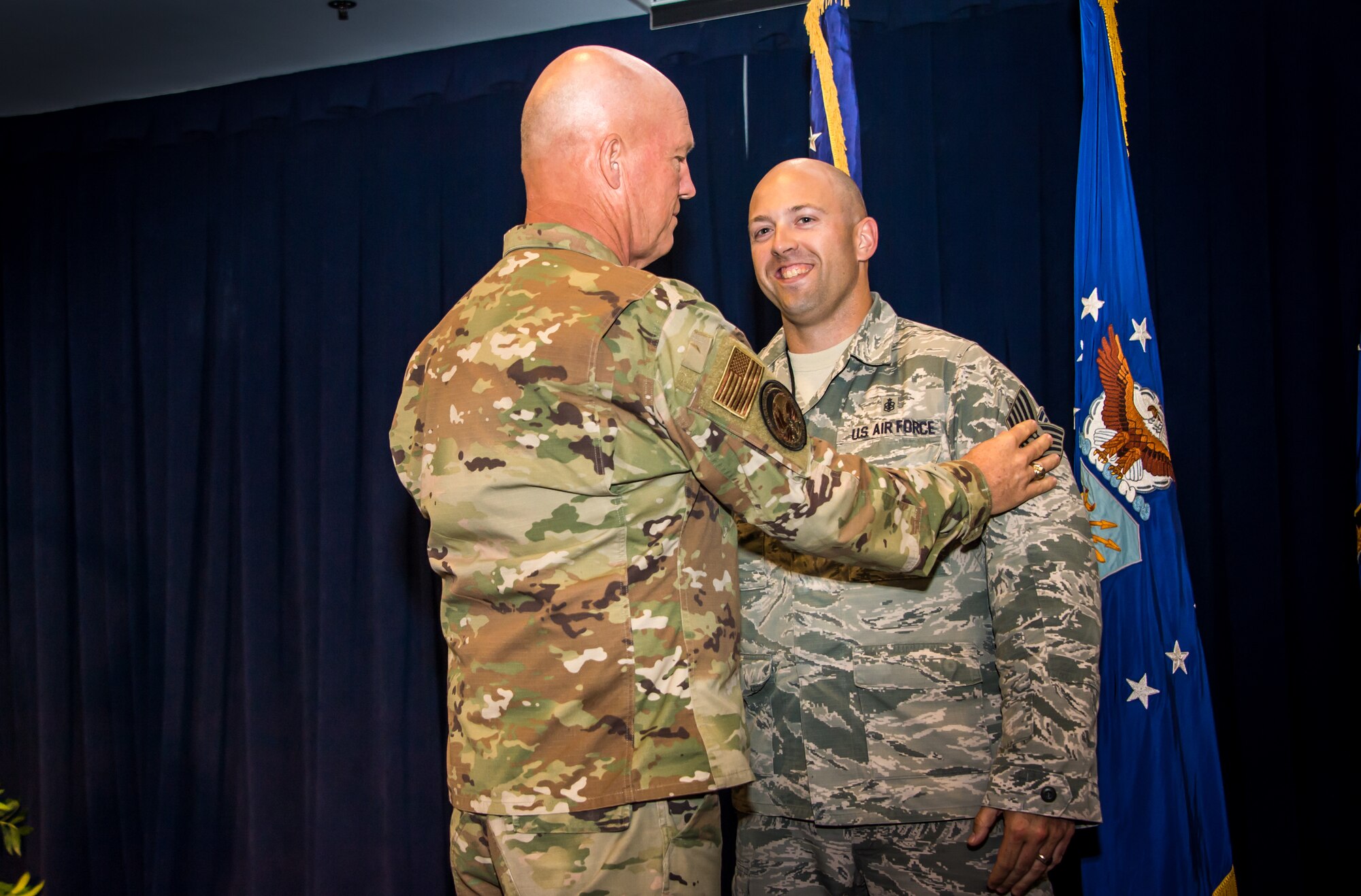 Gen. Jay Raymond, U.S. Space Command and Air Force Space Command commander, promotes SSgt Michael Toderick, 61st Medical Squadron non-commisioned officer in charge of community health, to the rank of Tech. Sgt. as a part of the Stripes for Exceptional Performers program (STEP), while visiting the Space and Missile Systems Center, Los Angeles Air Force Base, El Segundo, Calif., Oct. 1, 2019. The STEP program identifies and promotes the Air Force’s best performing Airmen. Each calendar year, major commands, Field Operating Agency and Direct Reporting Unit commanders, and senior Air Force officers with large enlisted populations are authorized to select a limited number of Airmen with exceptional potential for promotion to the ranks of Staff and Tech. Sgt. STEP-promotions are a rare honor and Gen. Raymond had only one stripe to give this year for the entire Command.
(U.S. Air Force photo by Van De Ha)