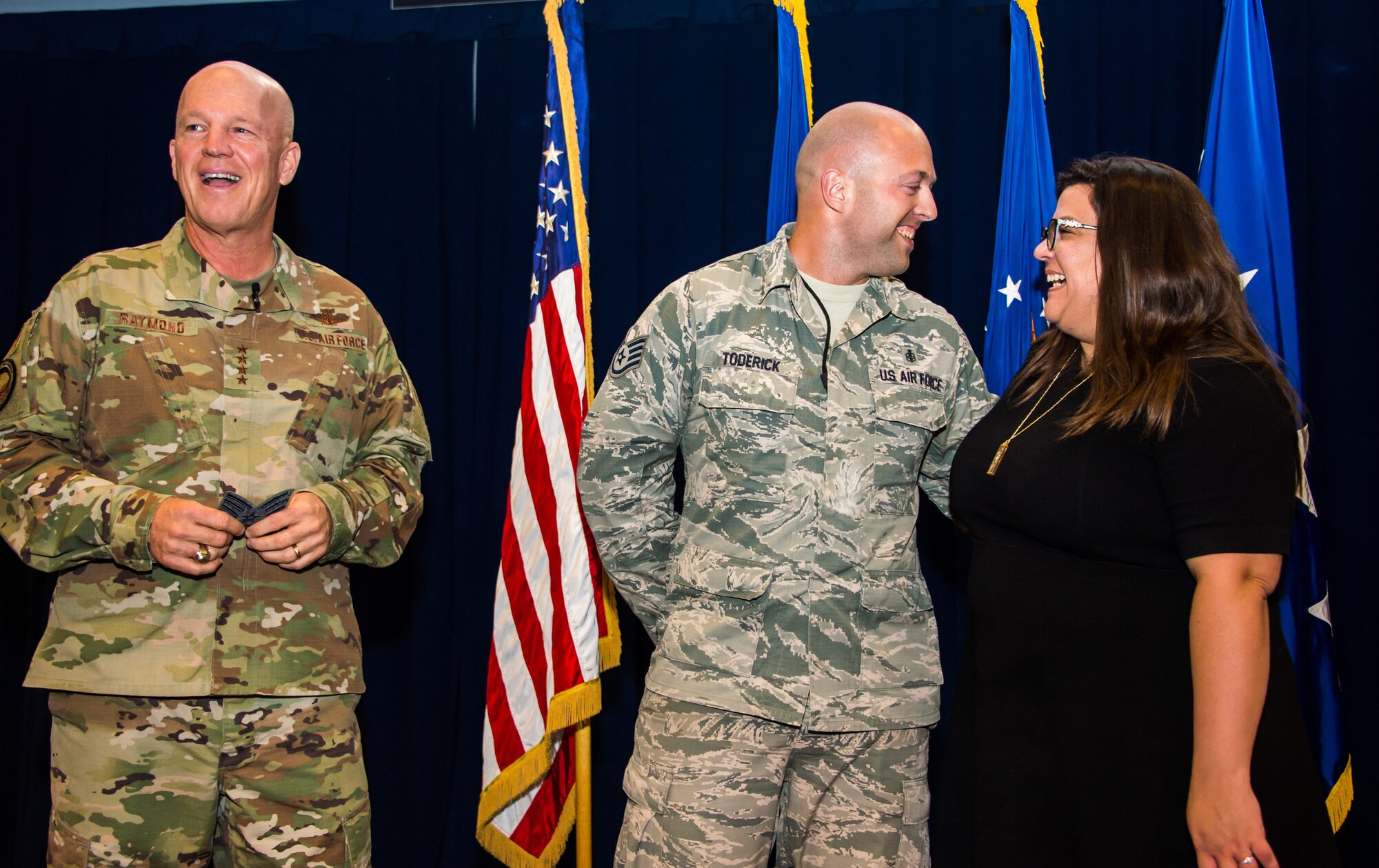 Gen. Jay Raymond, U.S. Space Command and Air Force Space Command commander, promotes SSgt Michael Toderick, 61st Medical Squadron non-commisioned officer in charge of community health, to the rank of Tech. Sgt. as a part of the Stripes for Exceptional Performers program (STEP), while visiting the Space and Missile Systems Center, Los Angeles Air Force Base, El Segundo, Calif., Oct. 1, 2019. Tech. Sgt. Toderick’s spouse, Jennette, surprised him on stage after the announcement. The STEP program identifies and promotes the Air Force’s best performing Airmen. Each calendar year, major commands, Field Operating Agency and Direct Reporting Unit commanders, and senior Air Force officers with large enlisted populations are authorized to select a limited number of Airmen with exceptional potential for promotion to the ranks of Staff and Tech. Sgt. STEP-promotions are a rare honor and Gen. Raymond had only one stripe to give this year for the entire Command.

(U.S. Air Force photo by Van De Ha)